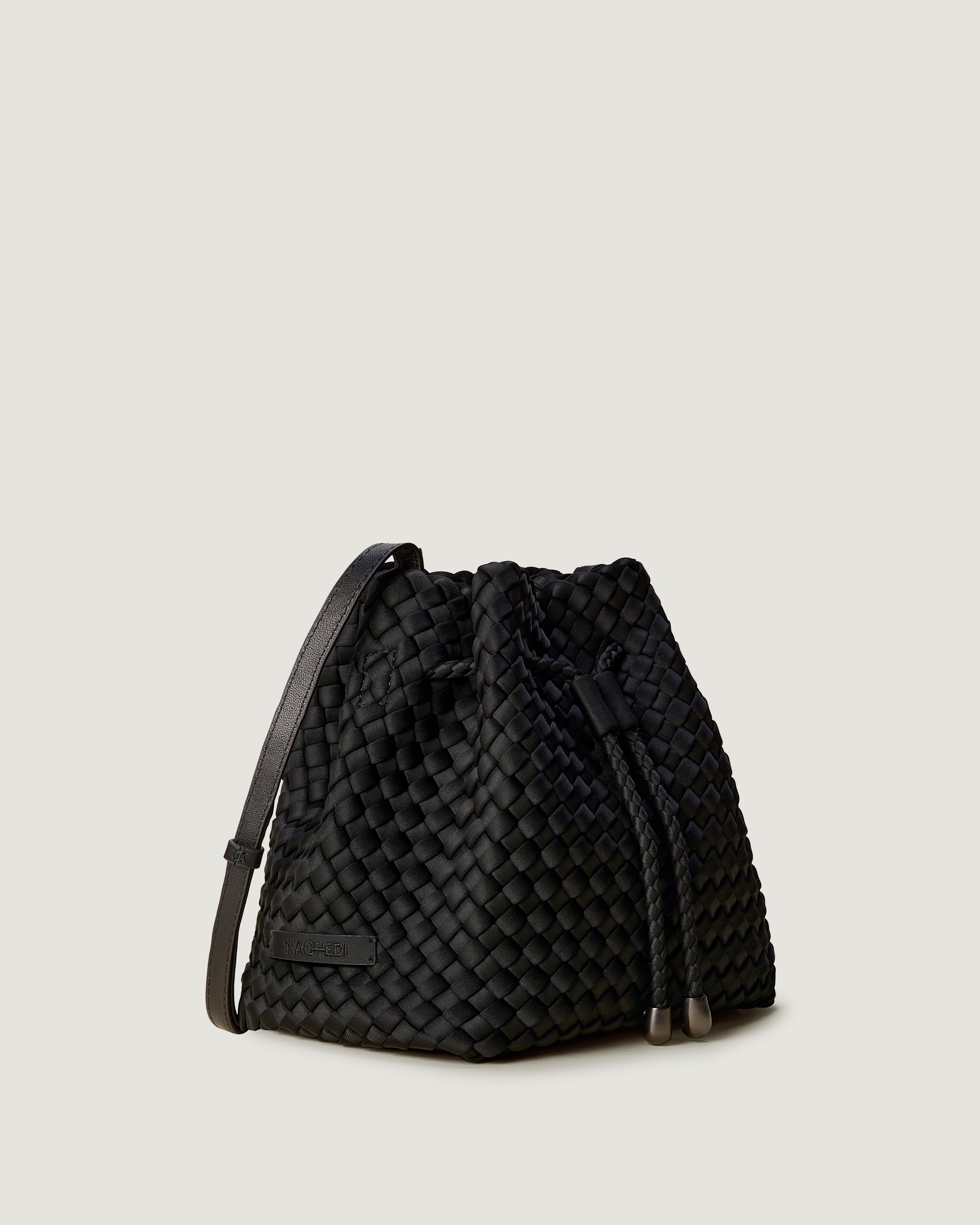 Gramercy Bucket in Onyx shown from a side angle, highlighting its handwoven neoprene construction and drawstring closure.