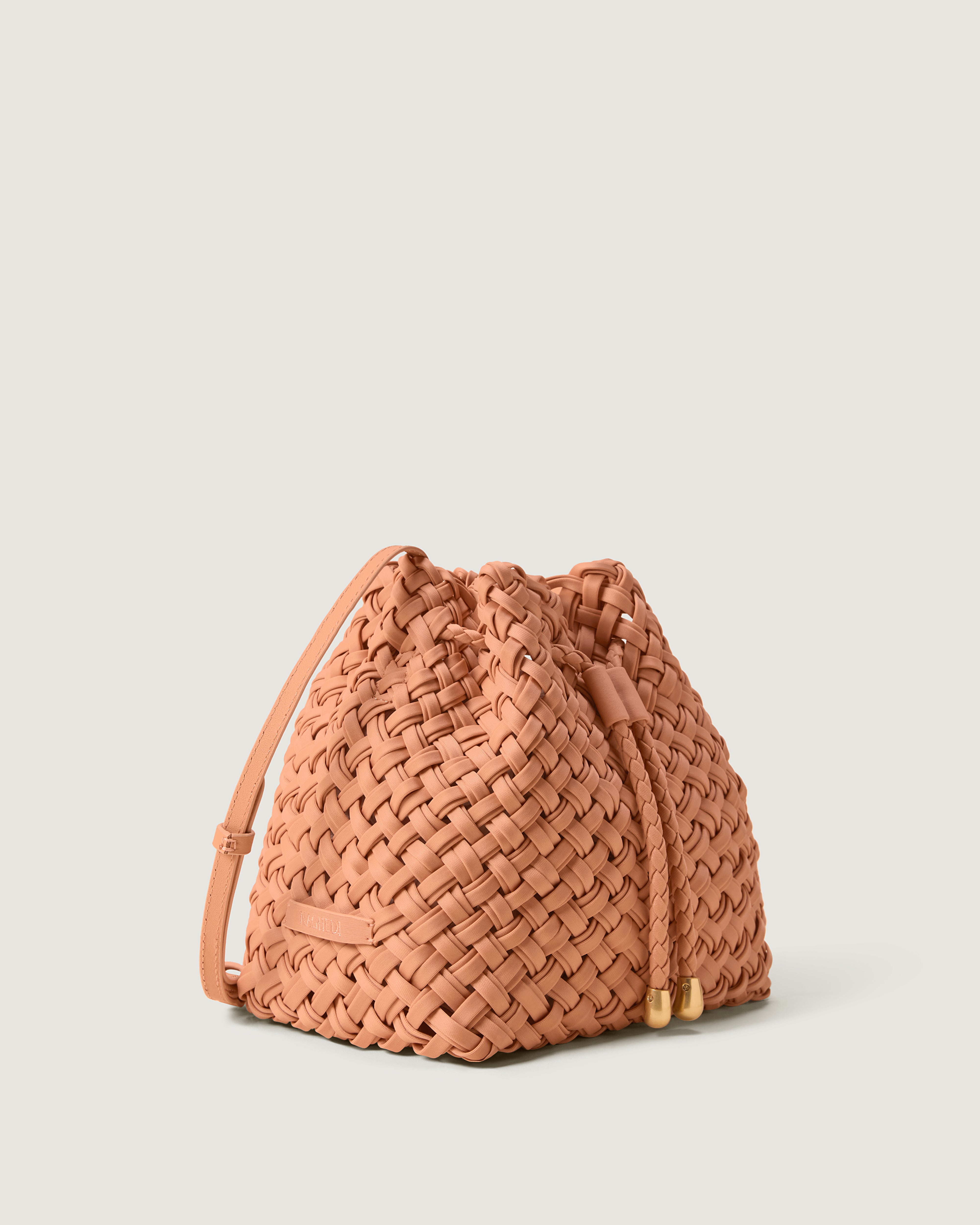 Gramercy Bucket in Etna shown from a side angle, highlighting its handwoven neoprene construction and drawstring closure.