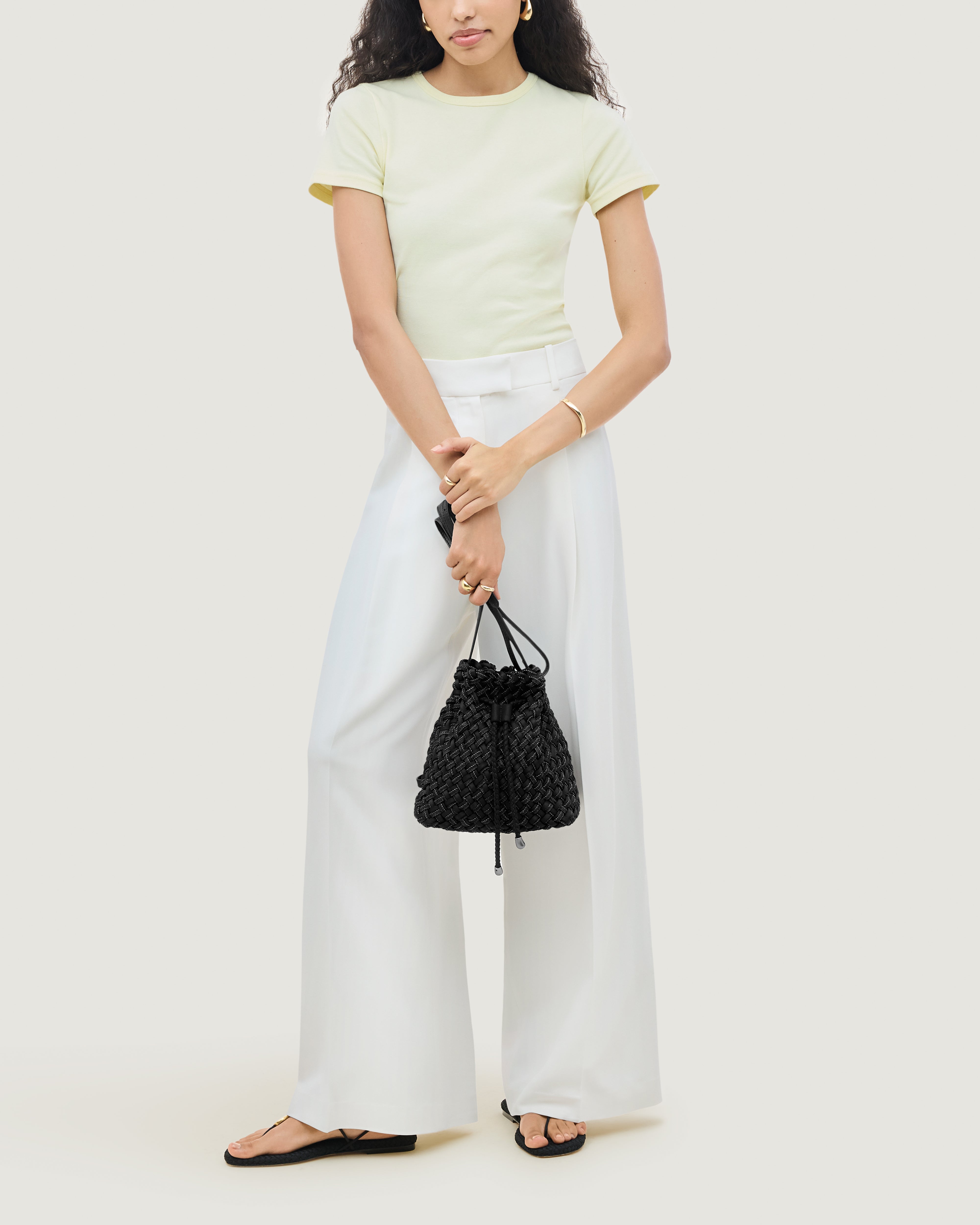 Gramercy Bucket in Jet shown on model to illustrate scale and soft silhouette.