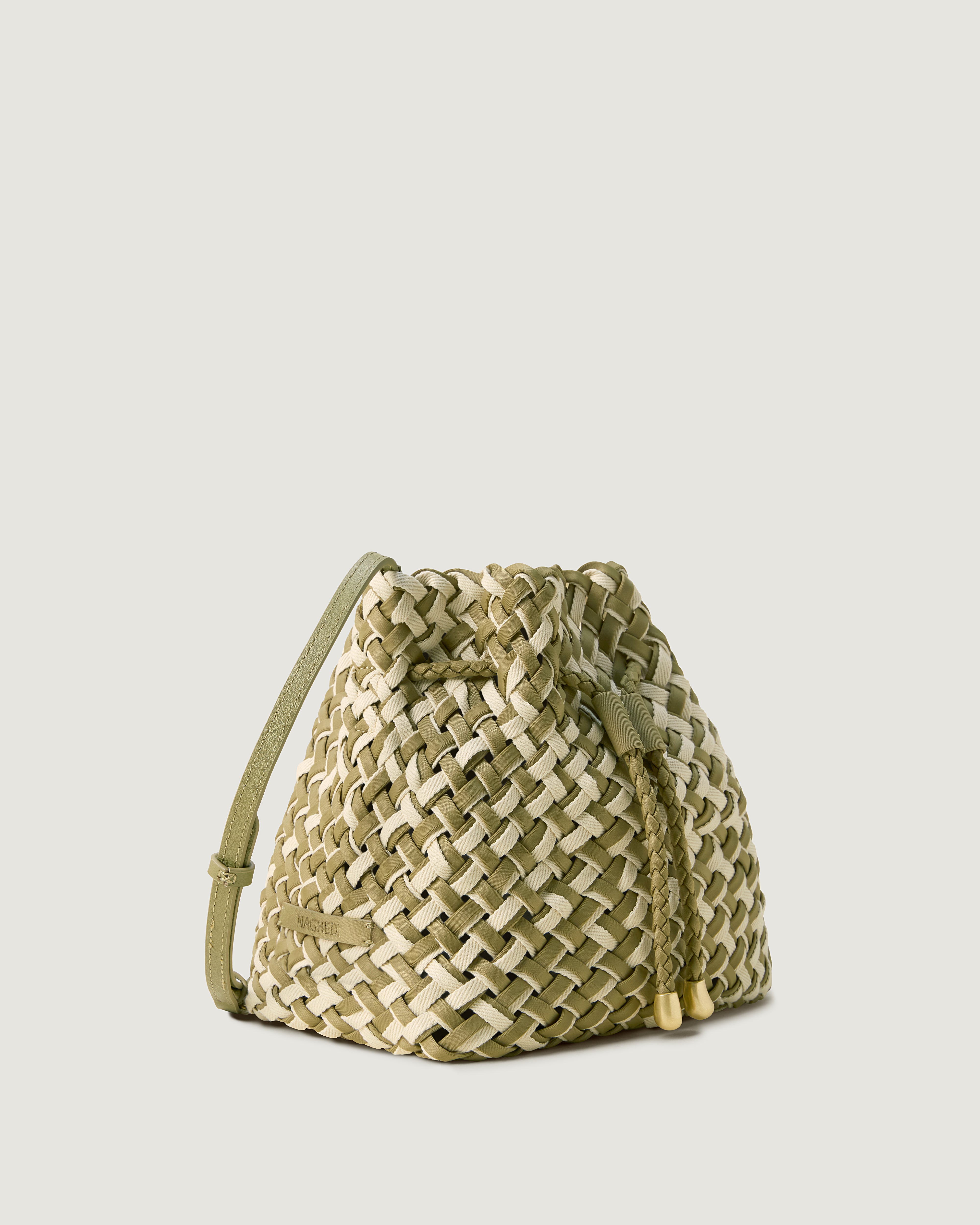 Gramercy Bucket in Oletta shown from a side angle, highlighting its handwoven neoprene construction and drawstring closure.