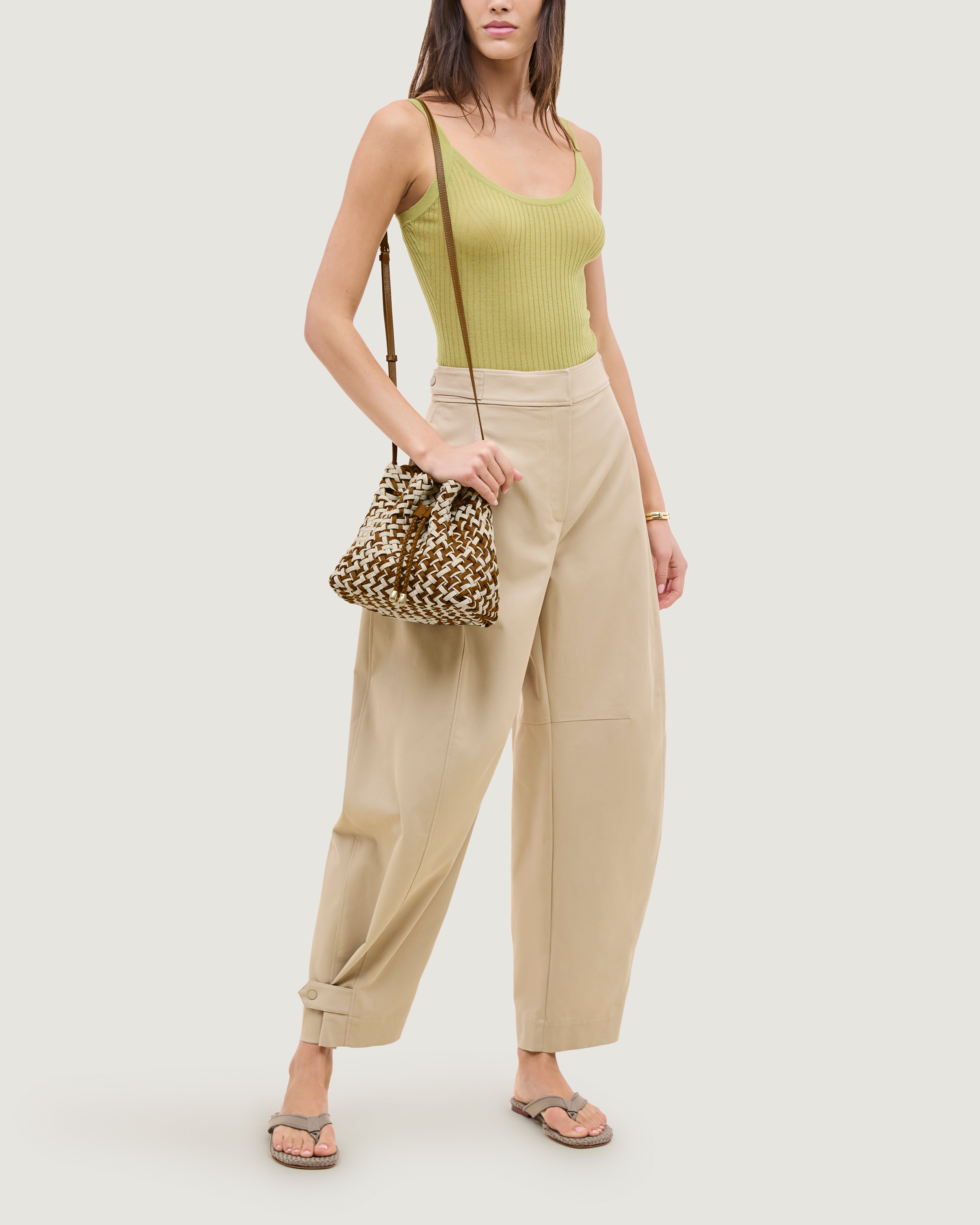 Gramercy Bucket in Carmel shown on model to illustrate scale and soft silhouette.