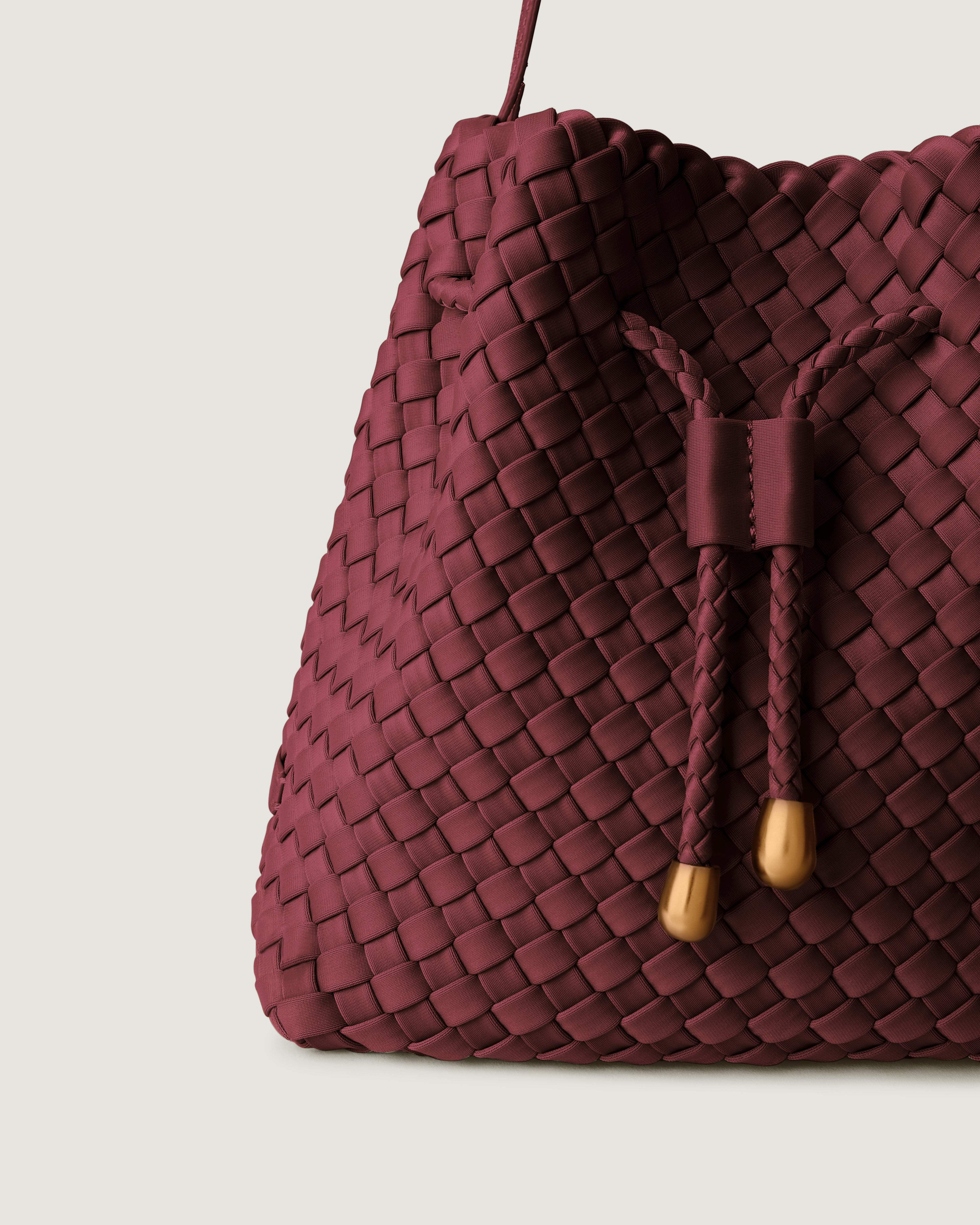 Close-up of handwoven detailing on Gramercy Bucket in Bordeaux.