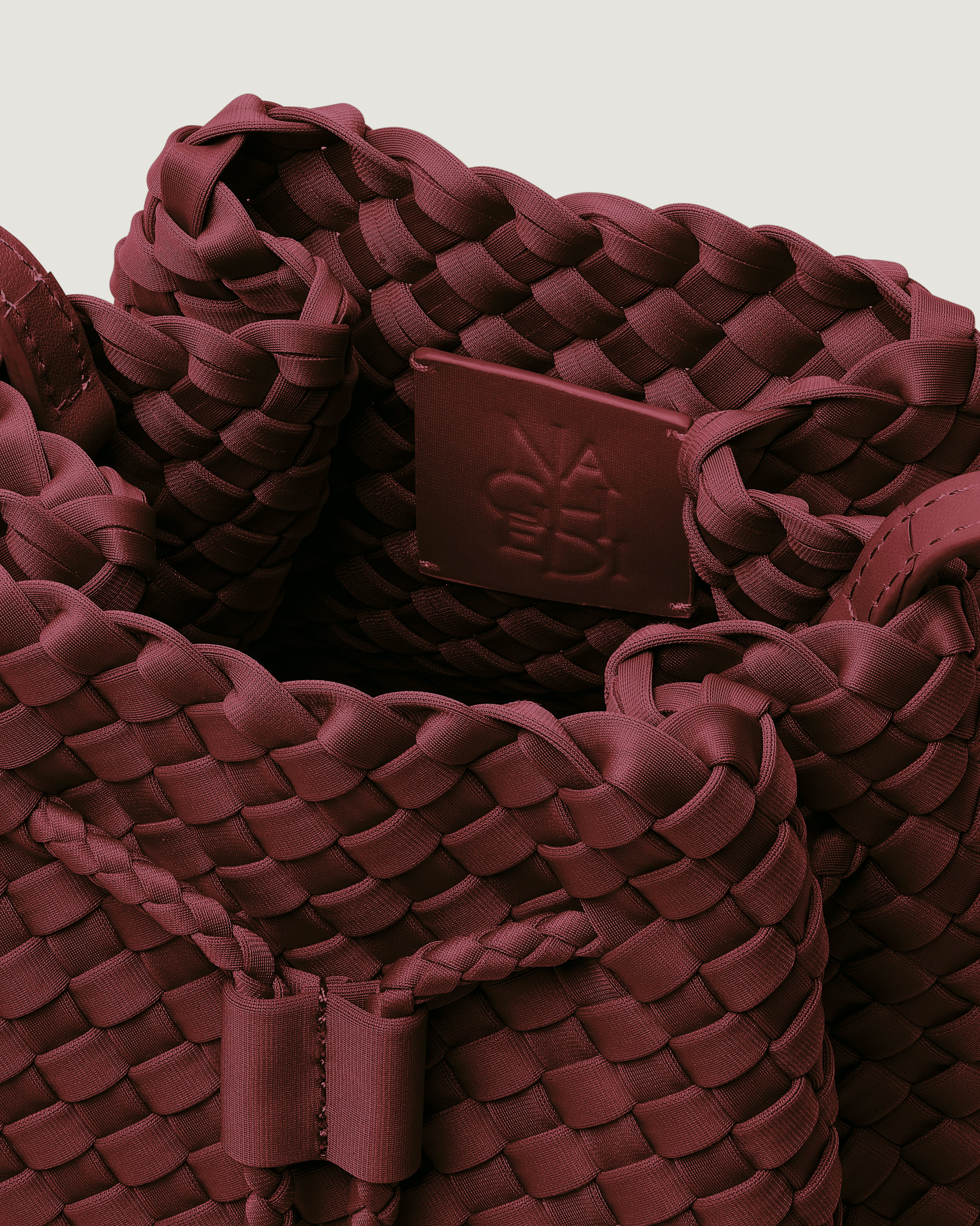 Interior close-up of Gramercy Bucket in Bordeaux showing its drawstring closure, and unlined interior.