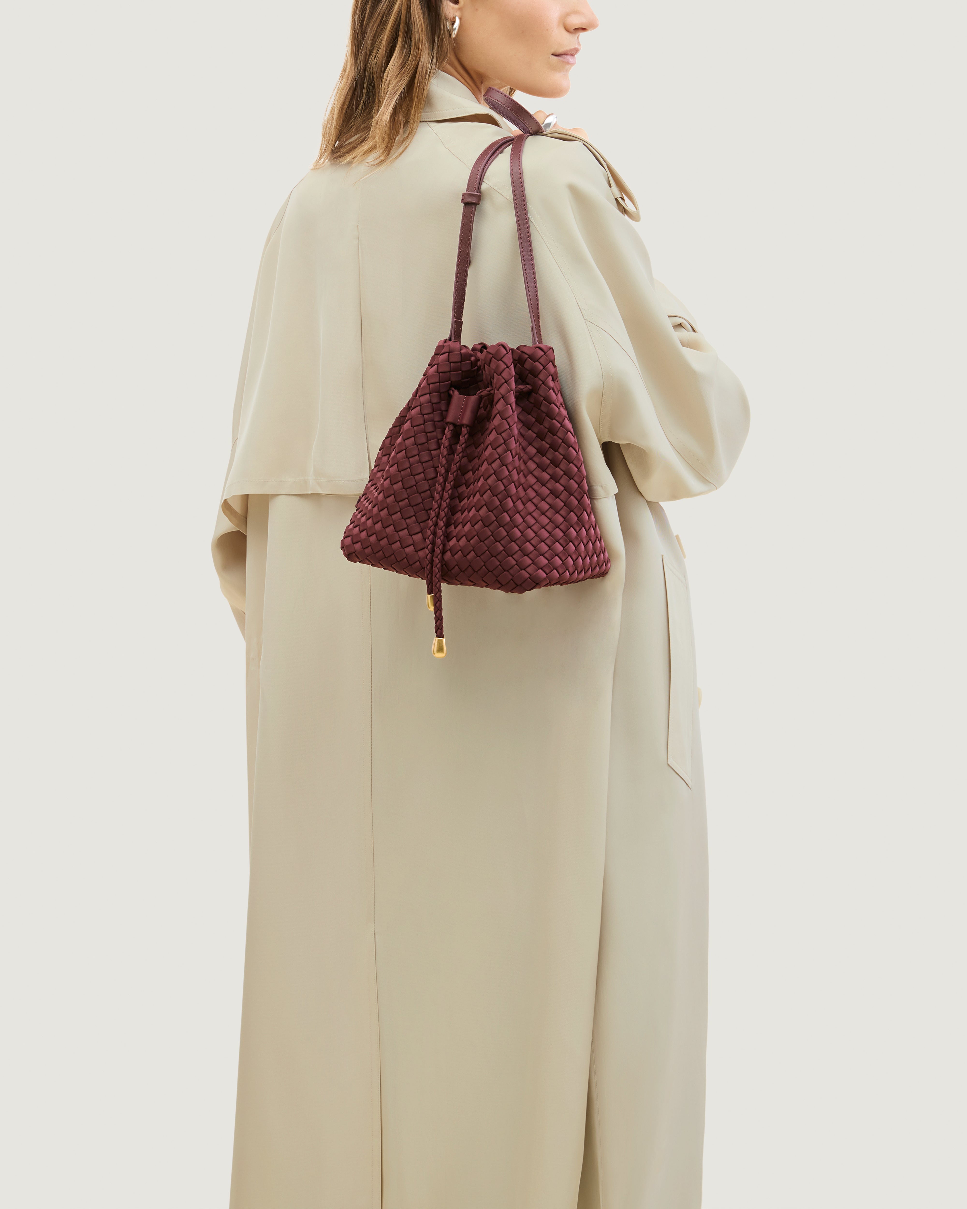 Gramercy Bucket in Bordeaux shown on model to illustrate scale and soft silhouette.