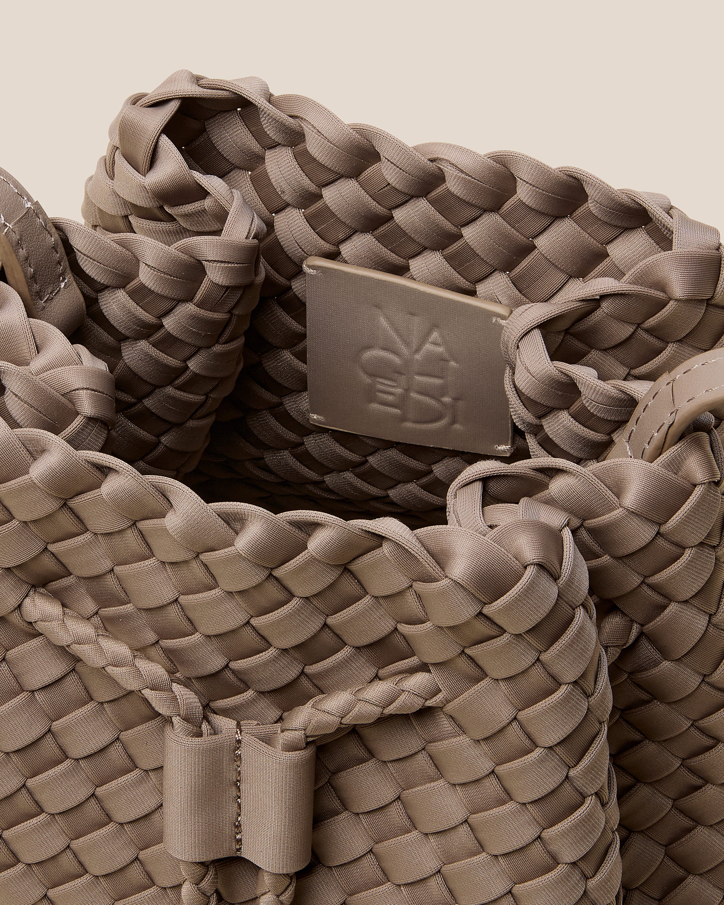 Interior close-up of Gramercy Bucket in Cashmere showing its drawstring closure, and unlined interior.