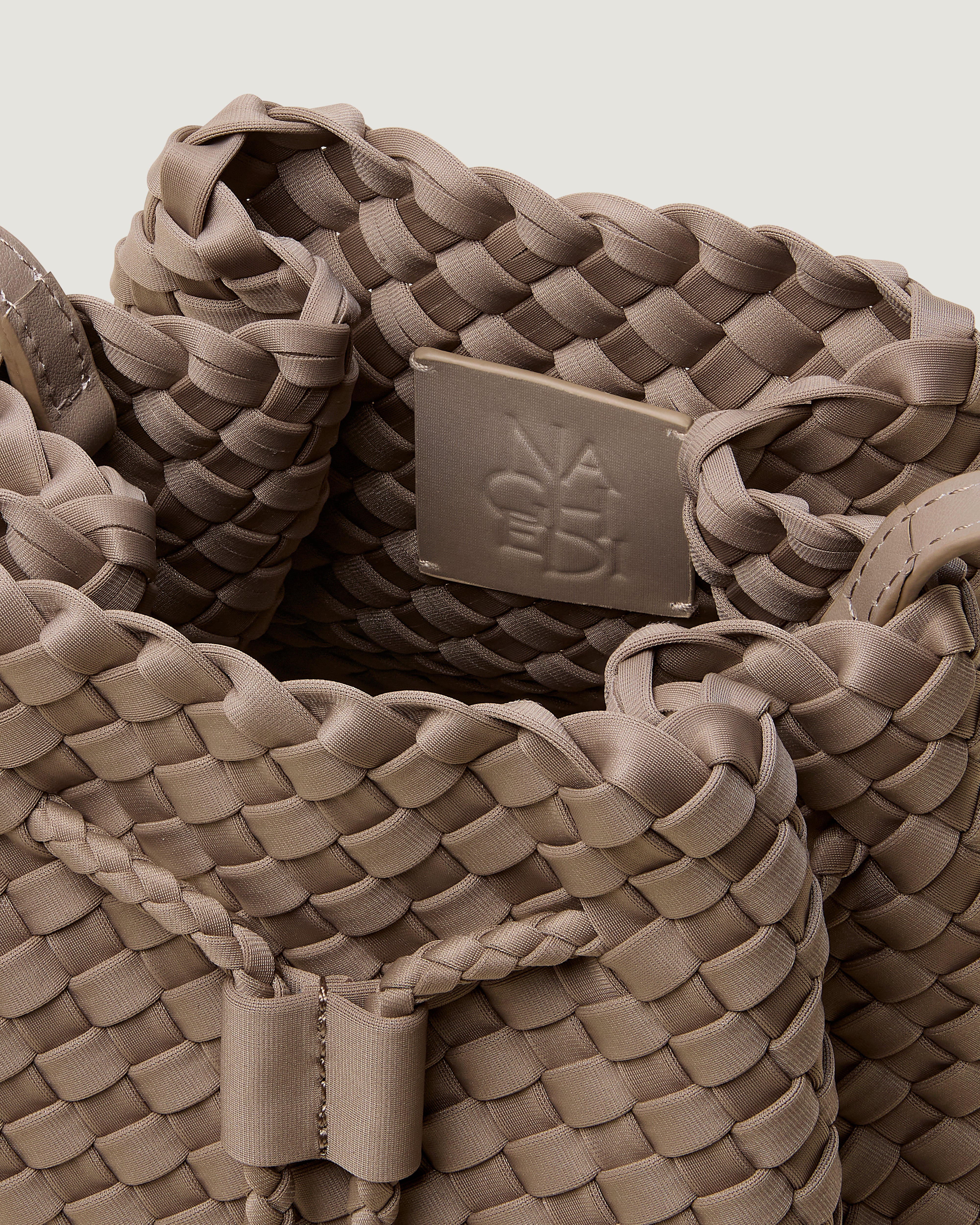 Interior close-up of Gramercy Bucket in Cashmere showing its drawstring closure, and unlined interior.