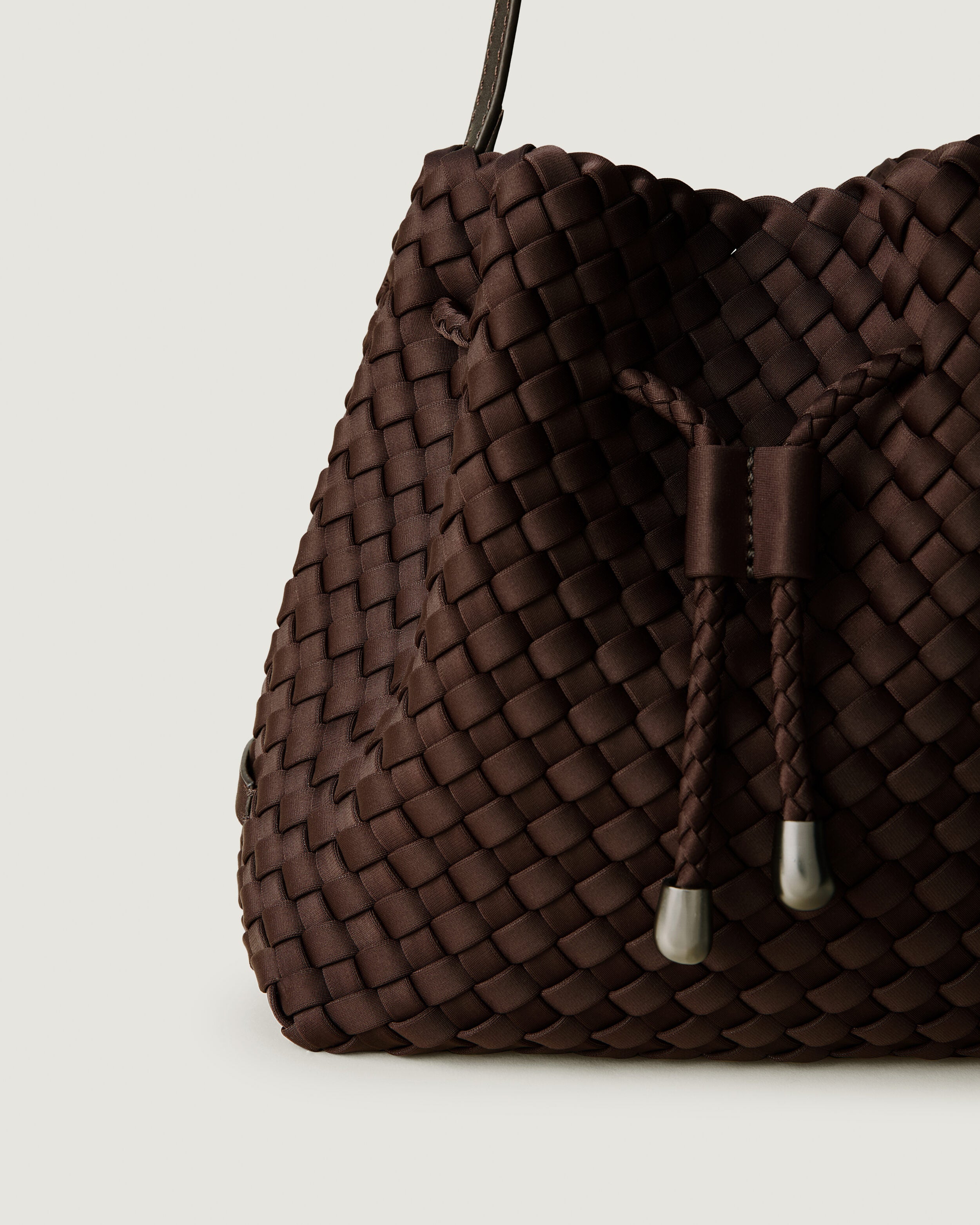 Close-up of handwoven detailing on Gramercy Bucket in Chocolate.