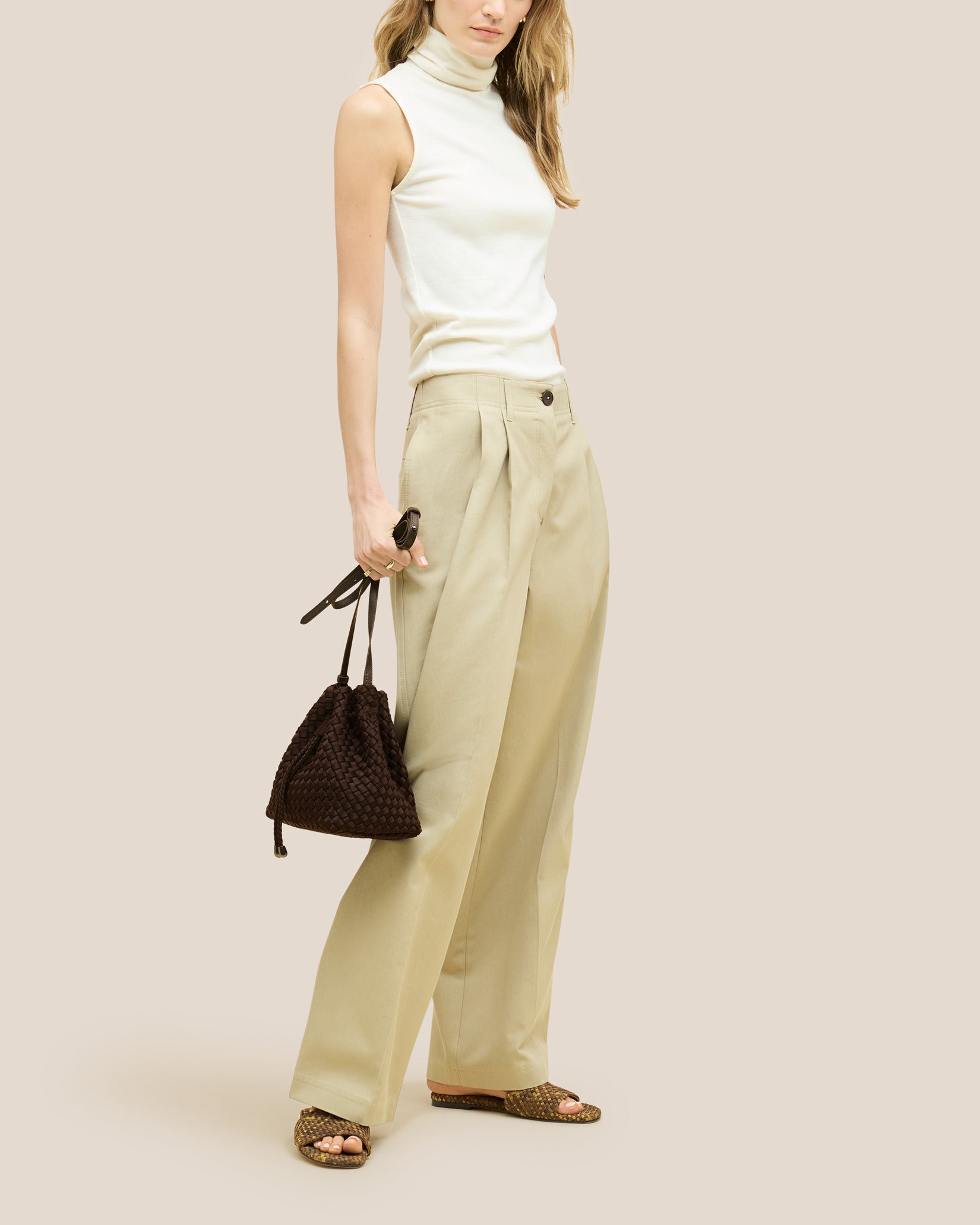 Gramercy Medium Bucket Bag in Chocolate shown on model to illustrate scale and soft silhouette.