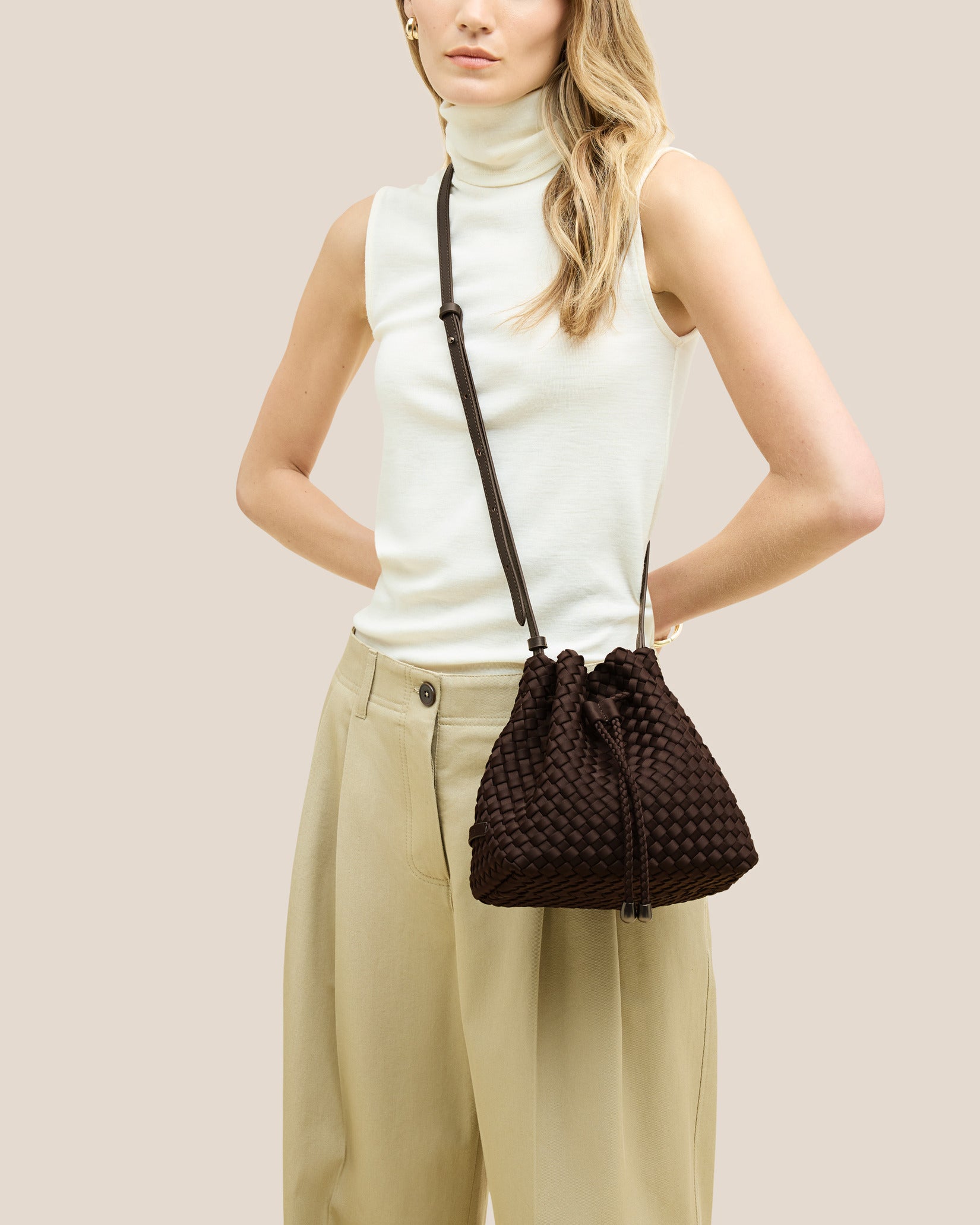 Gramercy Medium Bucket Bag in Chocolate shown on model to illustrate scale and soft silhouette.