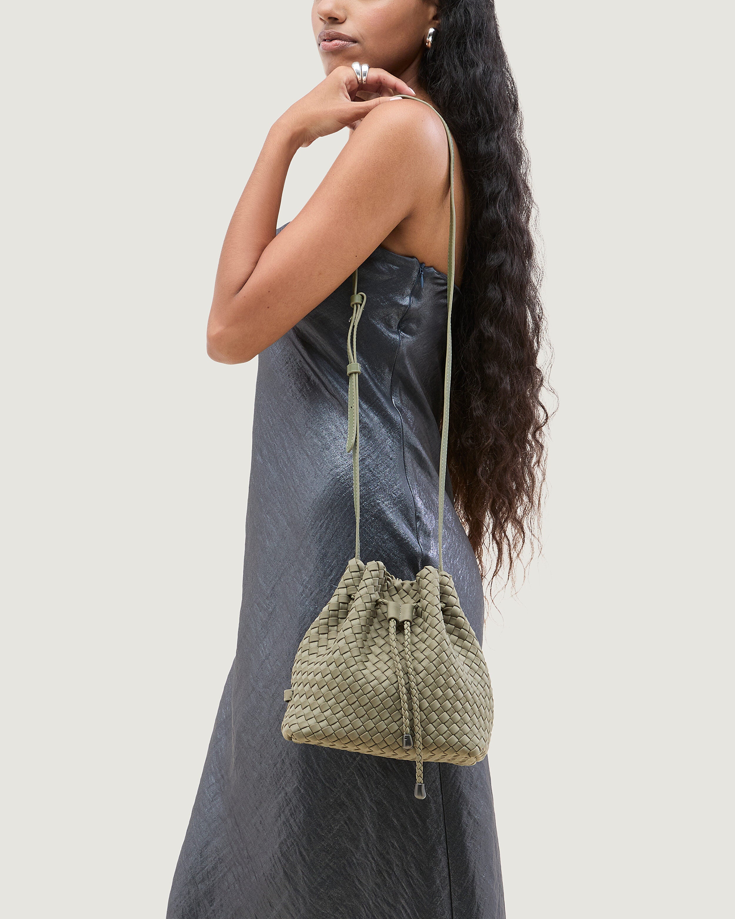 Gramercy Bucket in Olea shown on model to illustrate scale and soft silhouette.