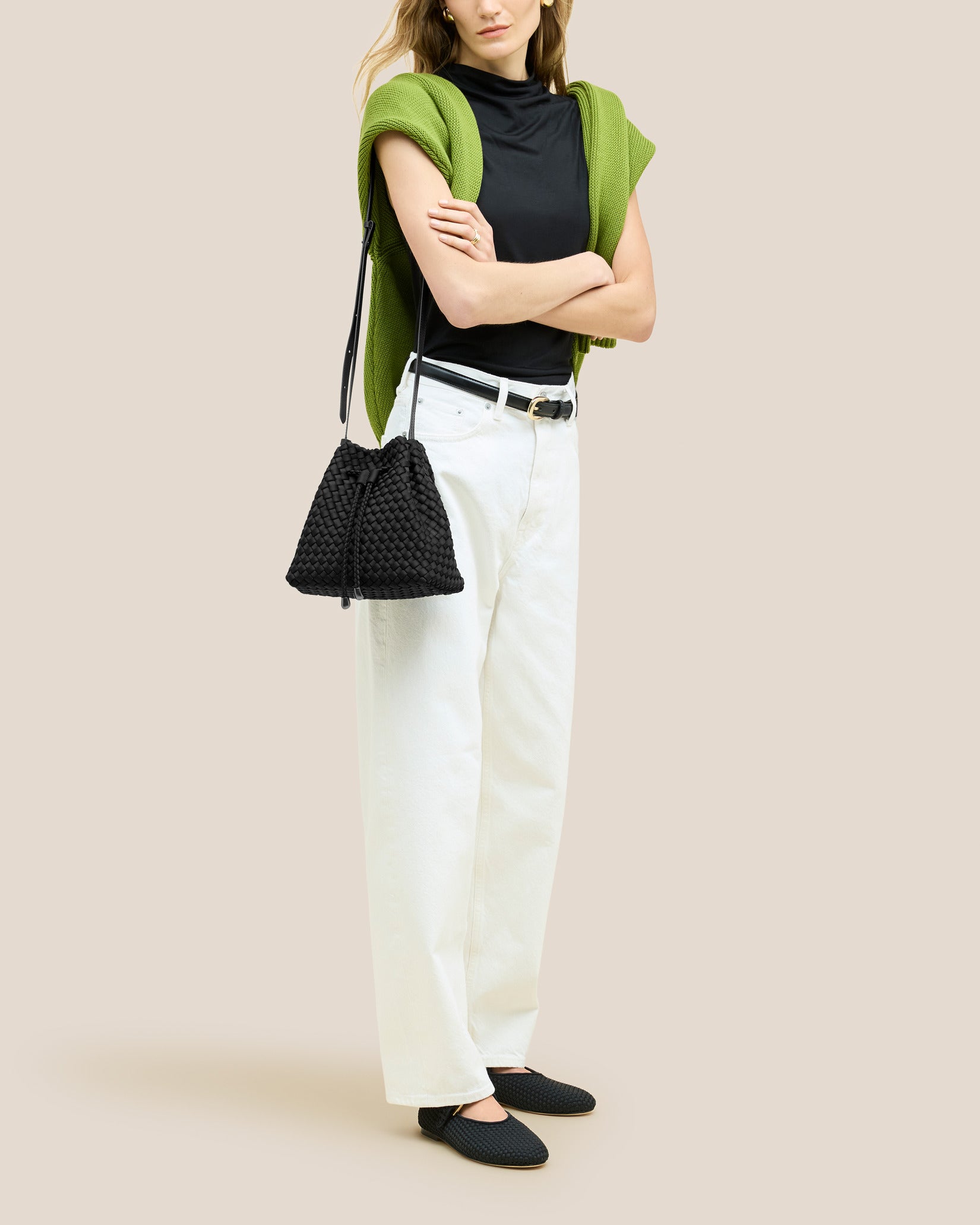 Gramercy Medium Bucket Bag in Onyx shown on model to illustrate scale and soft silhouette.