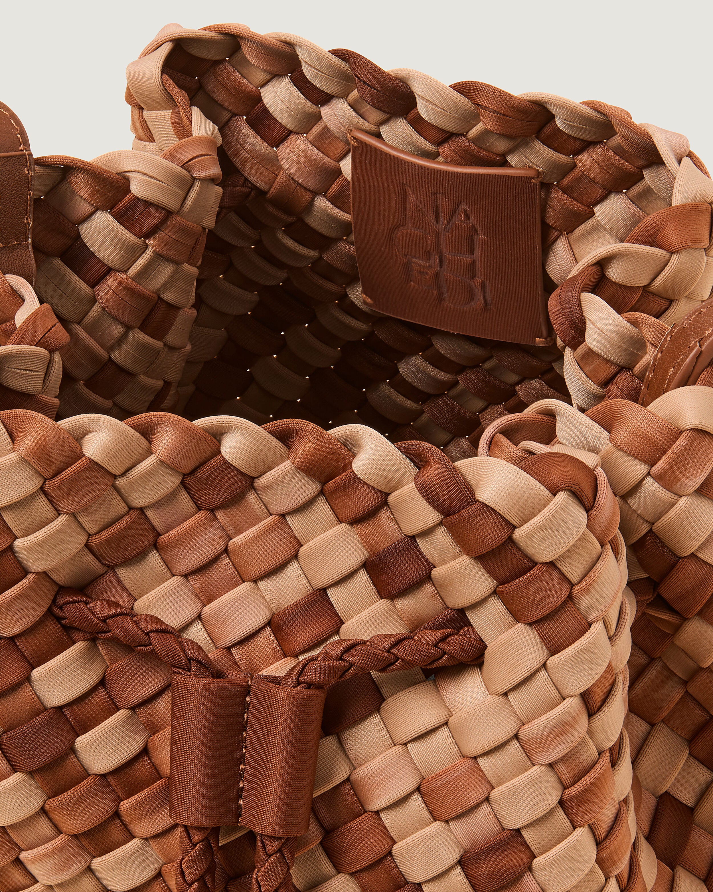 Interior close-up of Gramercy Bucket in Fez showing its drawstring closure, and unlined interior.