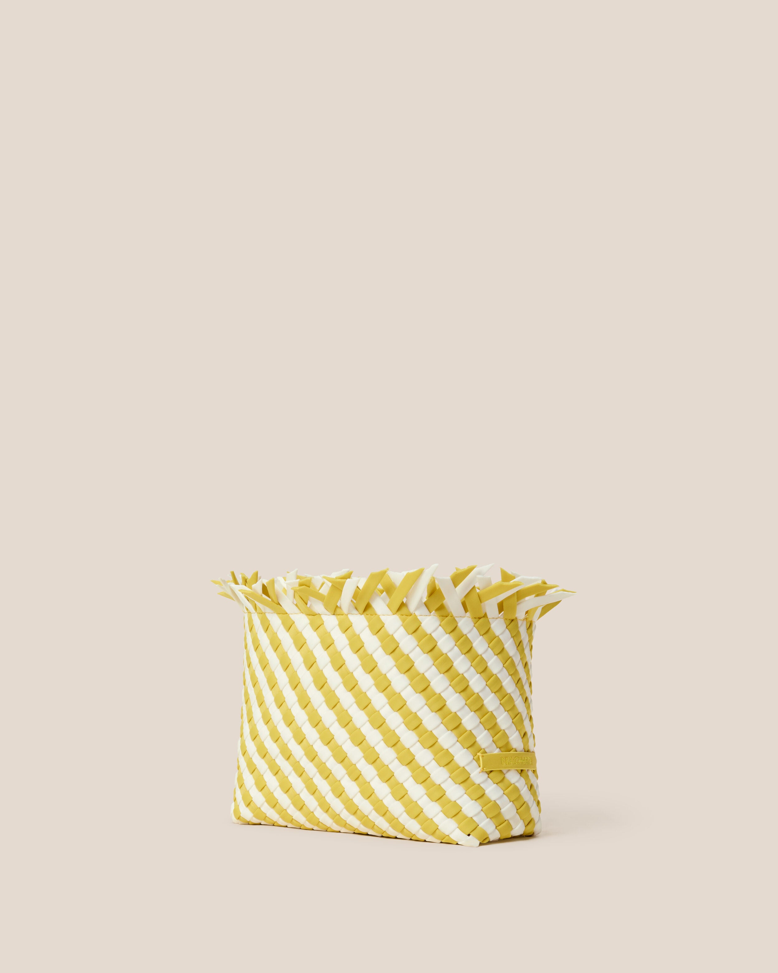Havana  in Soleil shown from a side angle, highlighting its handwoven neoprene construction and magnetic snap closure.