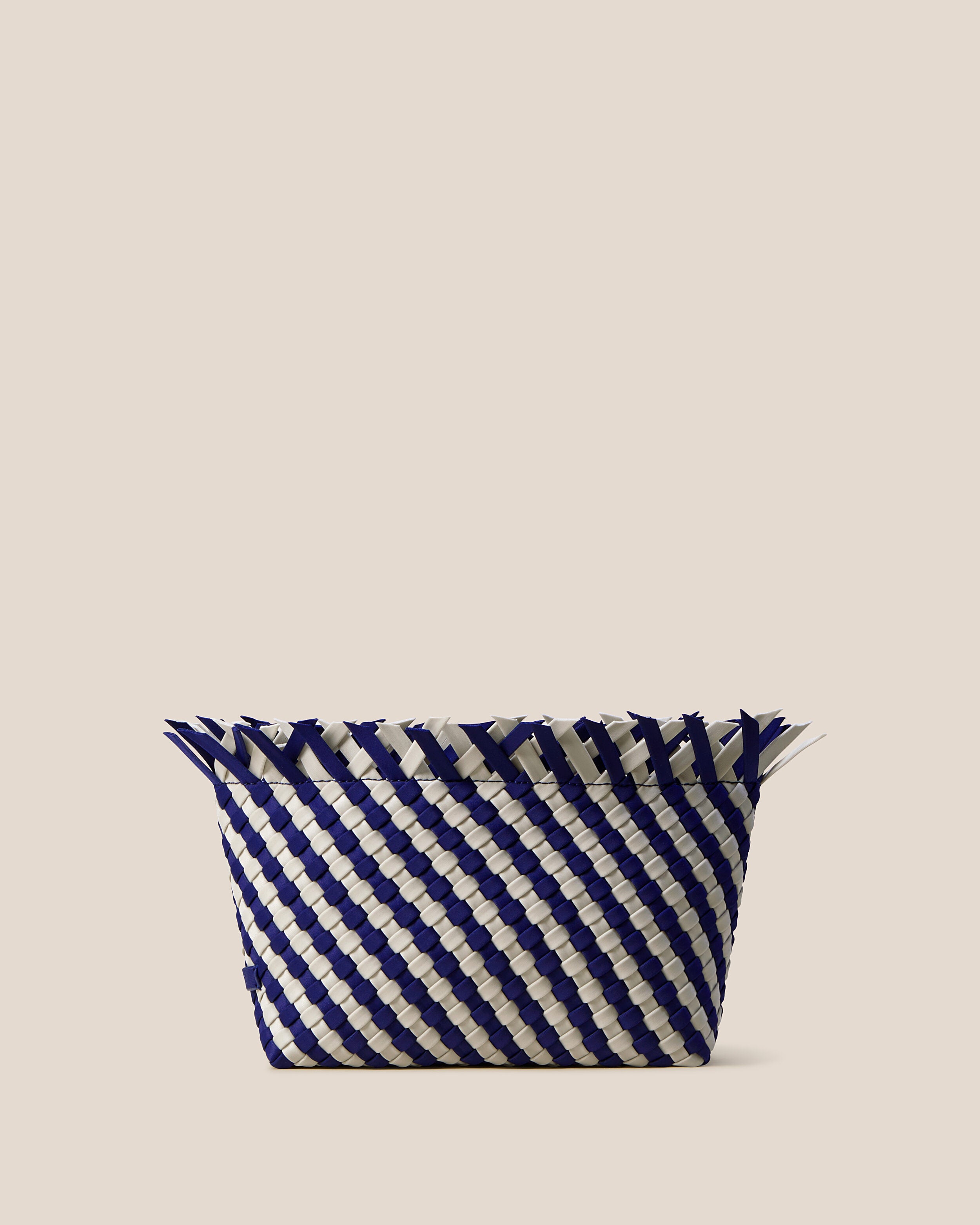Havana  in Venice, a navy blue and dove white tone, in handwoven neoprene, featuring a magnetic snap closure.