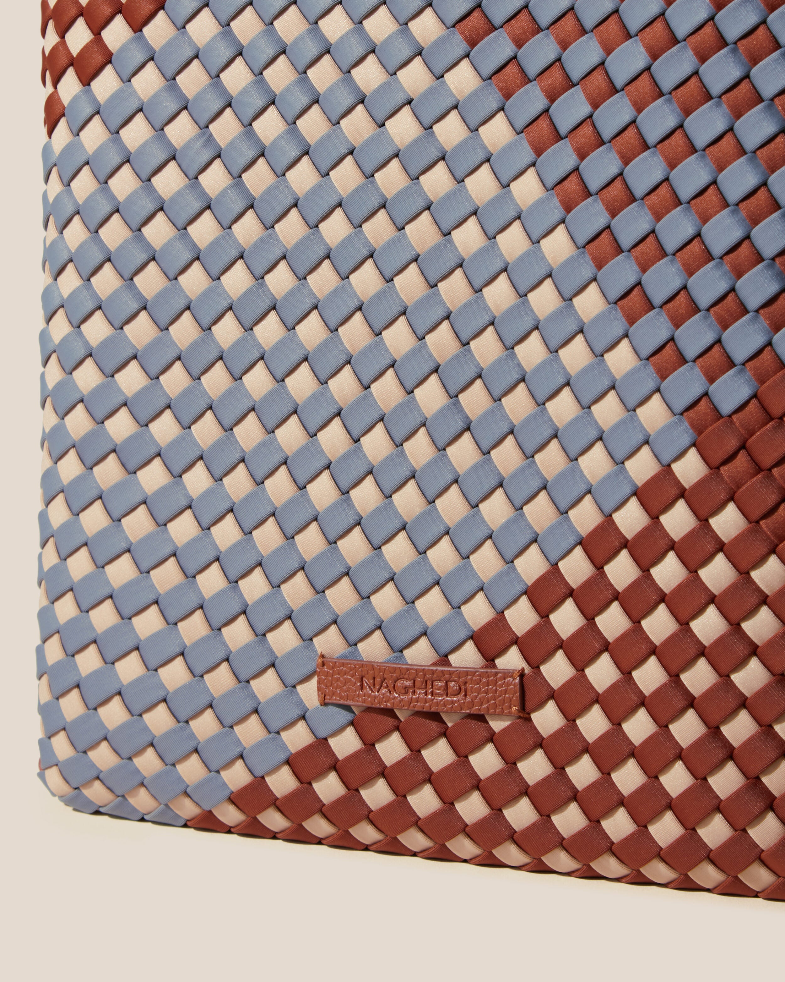 Close-up of stamped NAGHEDI logo on Havana  in Taos.