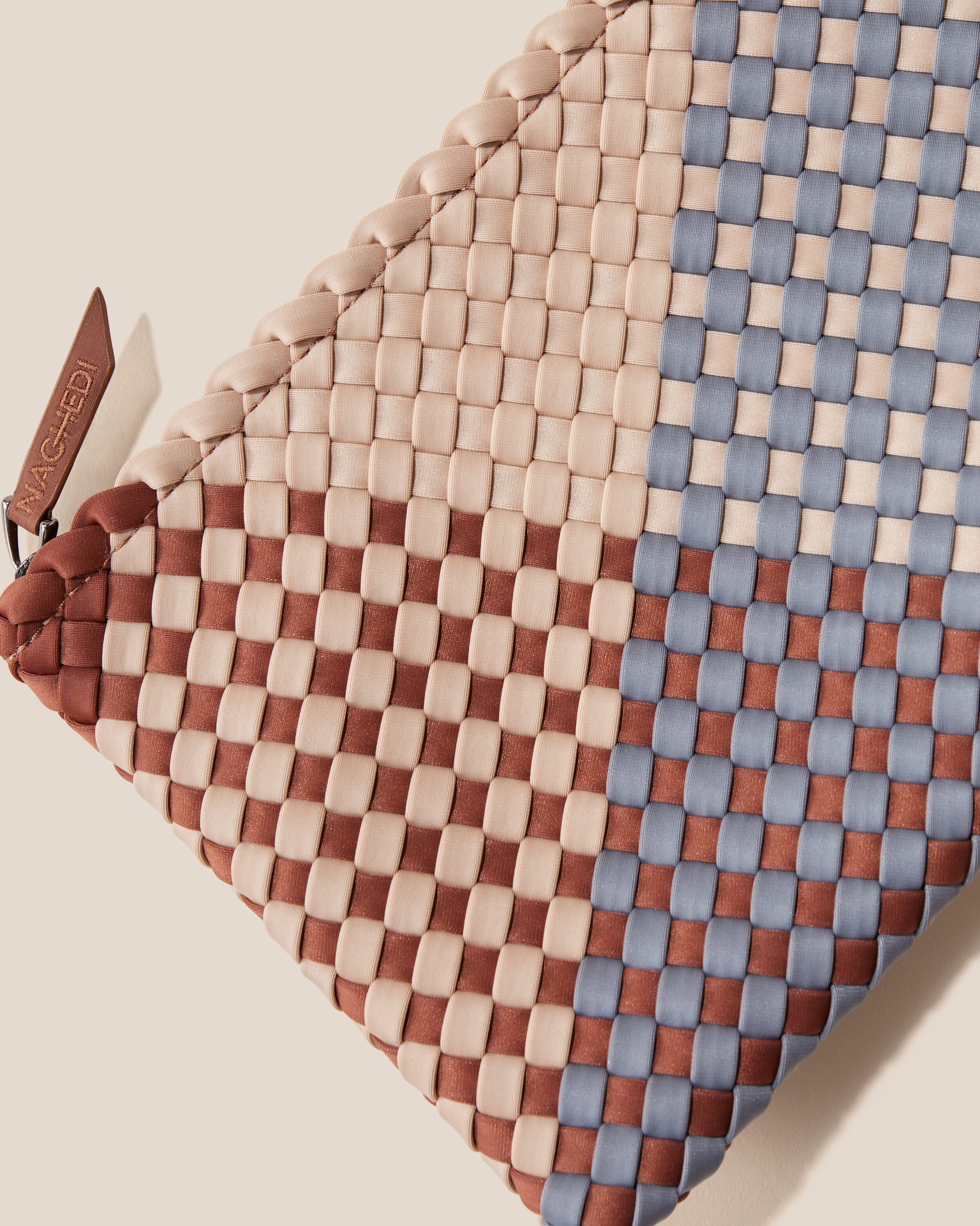 Close-up of included matching woven zippered pouch.