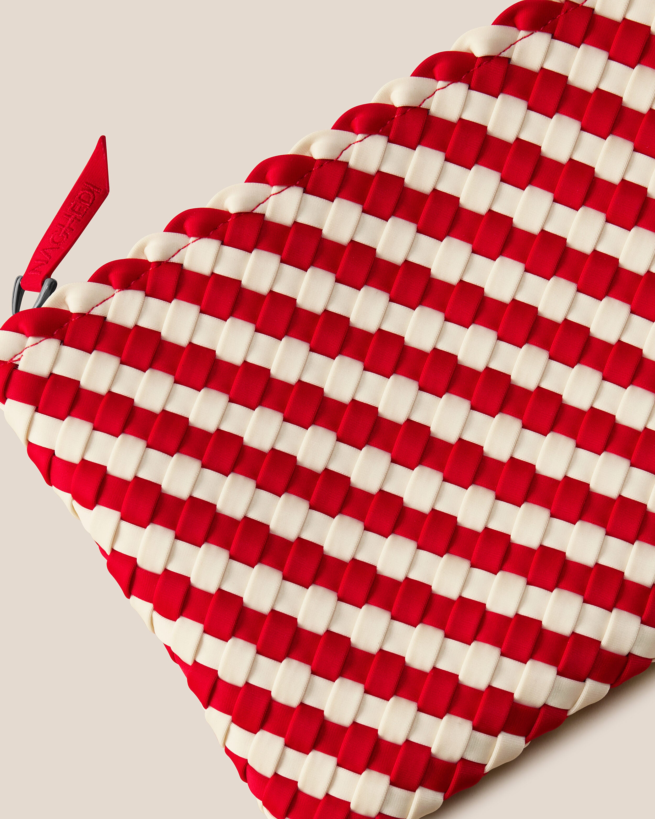 Close-up of included matching woven zippered pouch.