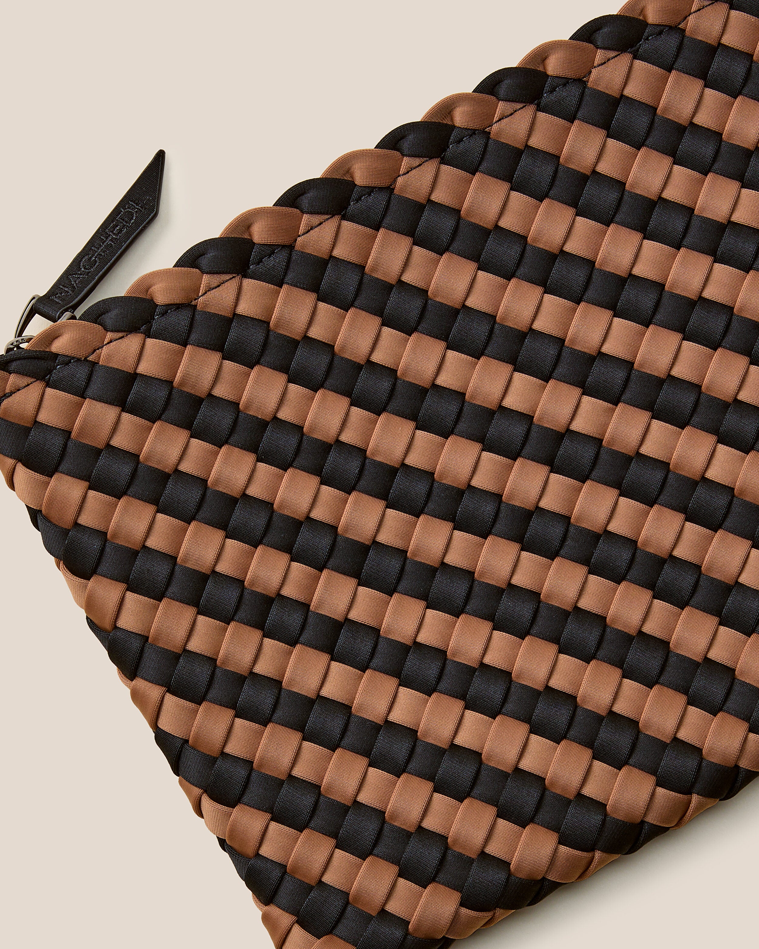 Close-up of included matching woven zippered pouch.