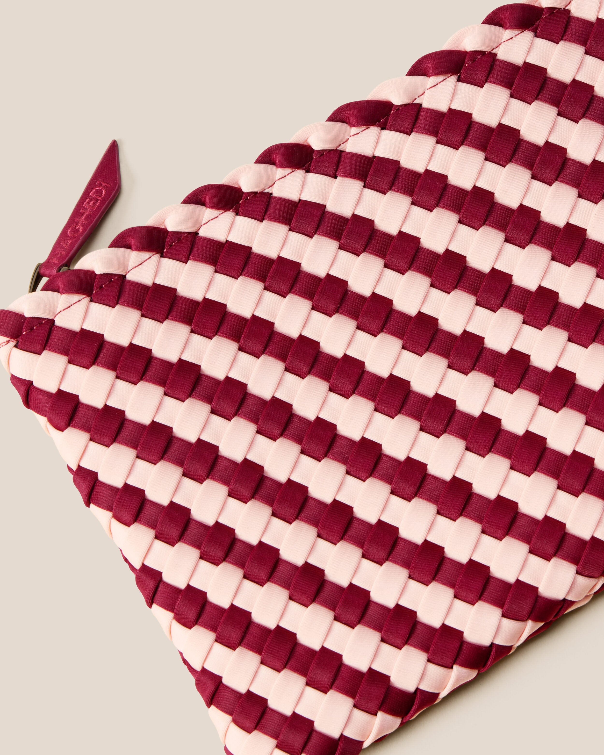 Close-up of included matching woven zippered pouch.