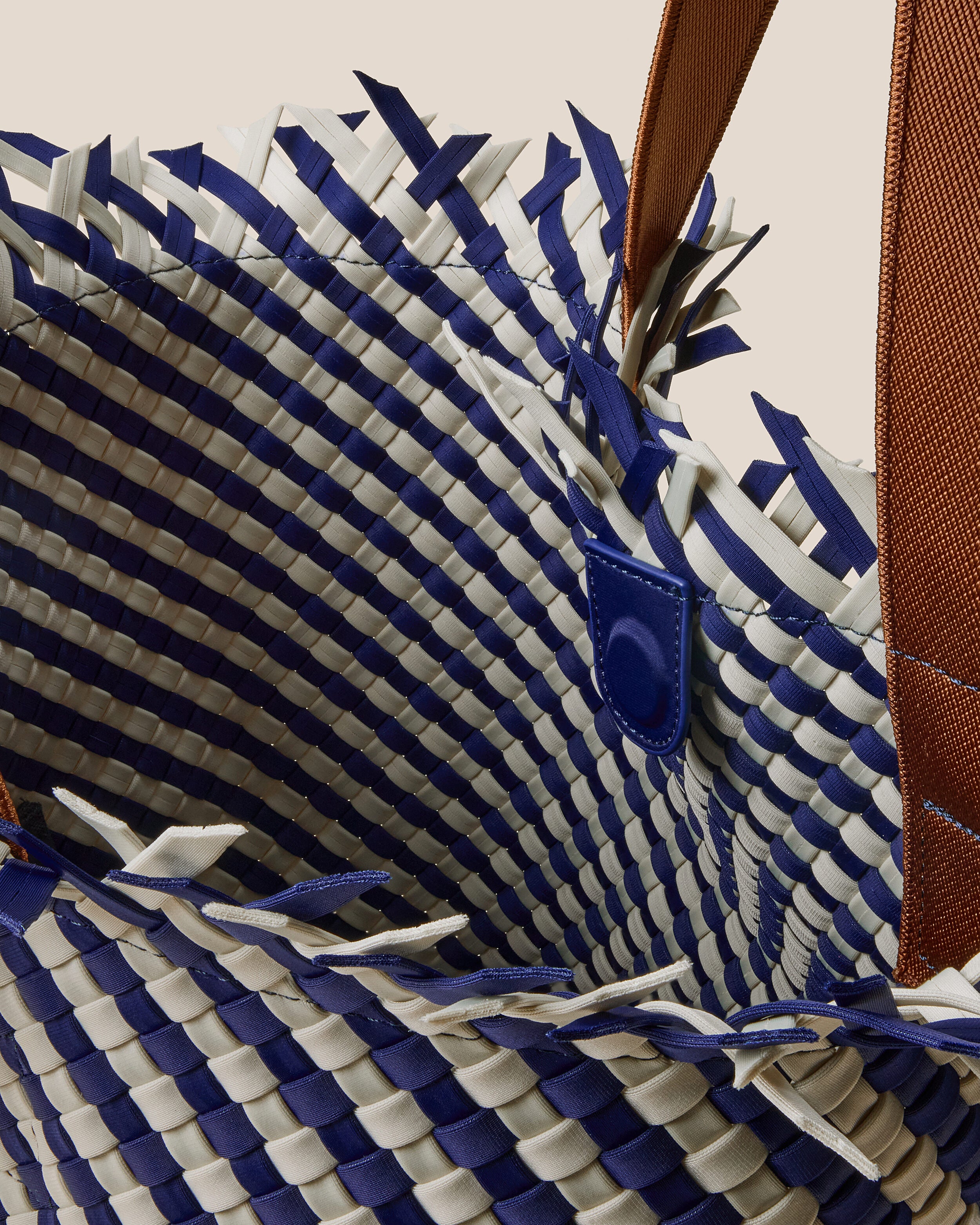 Interior close-up of Havana  in Venice showing its open top with magnetic snap closure, and unlined interior.