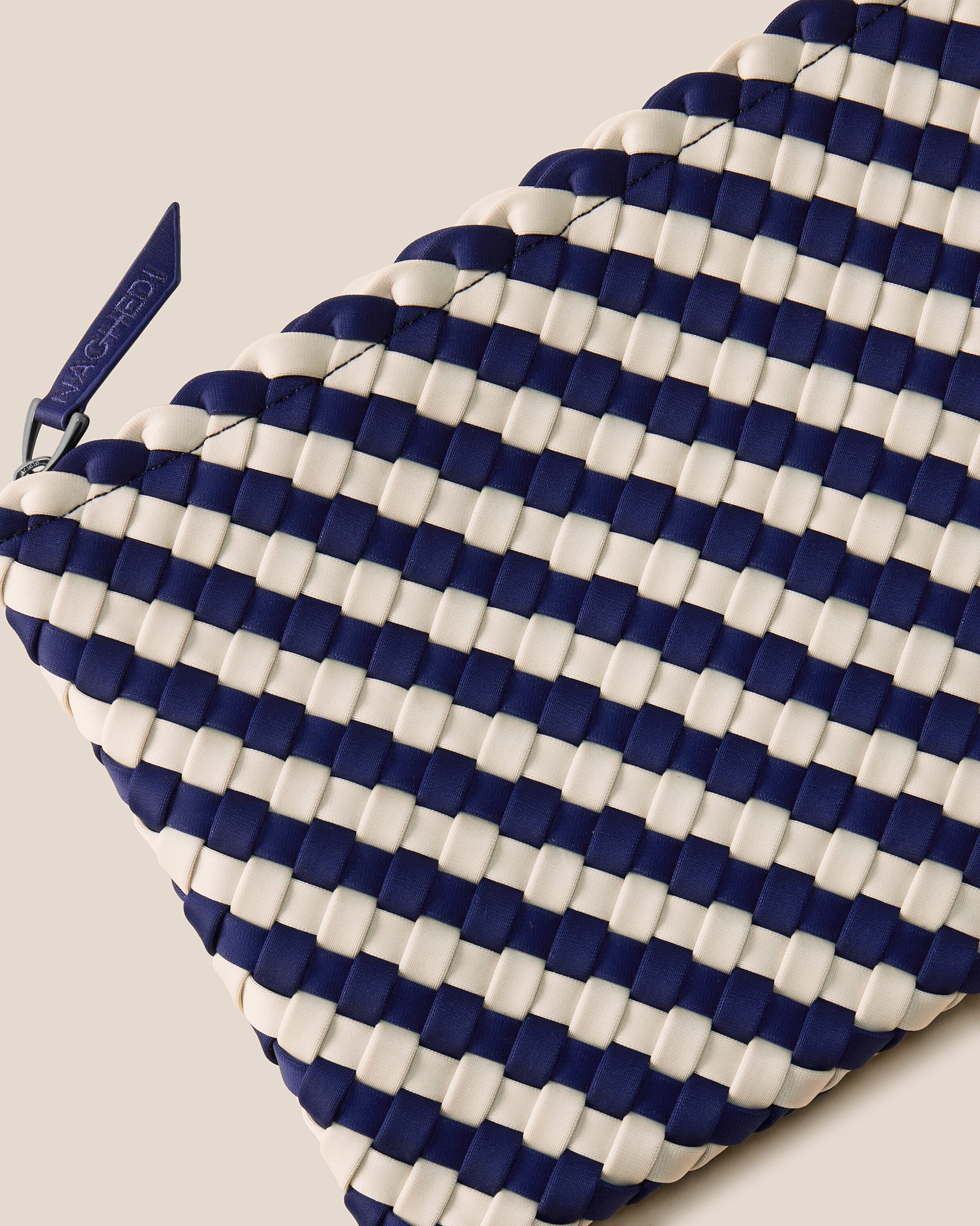 Close-up of included matching woven zippered pouch.