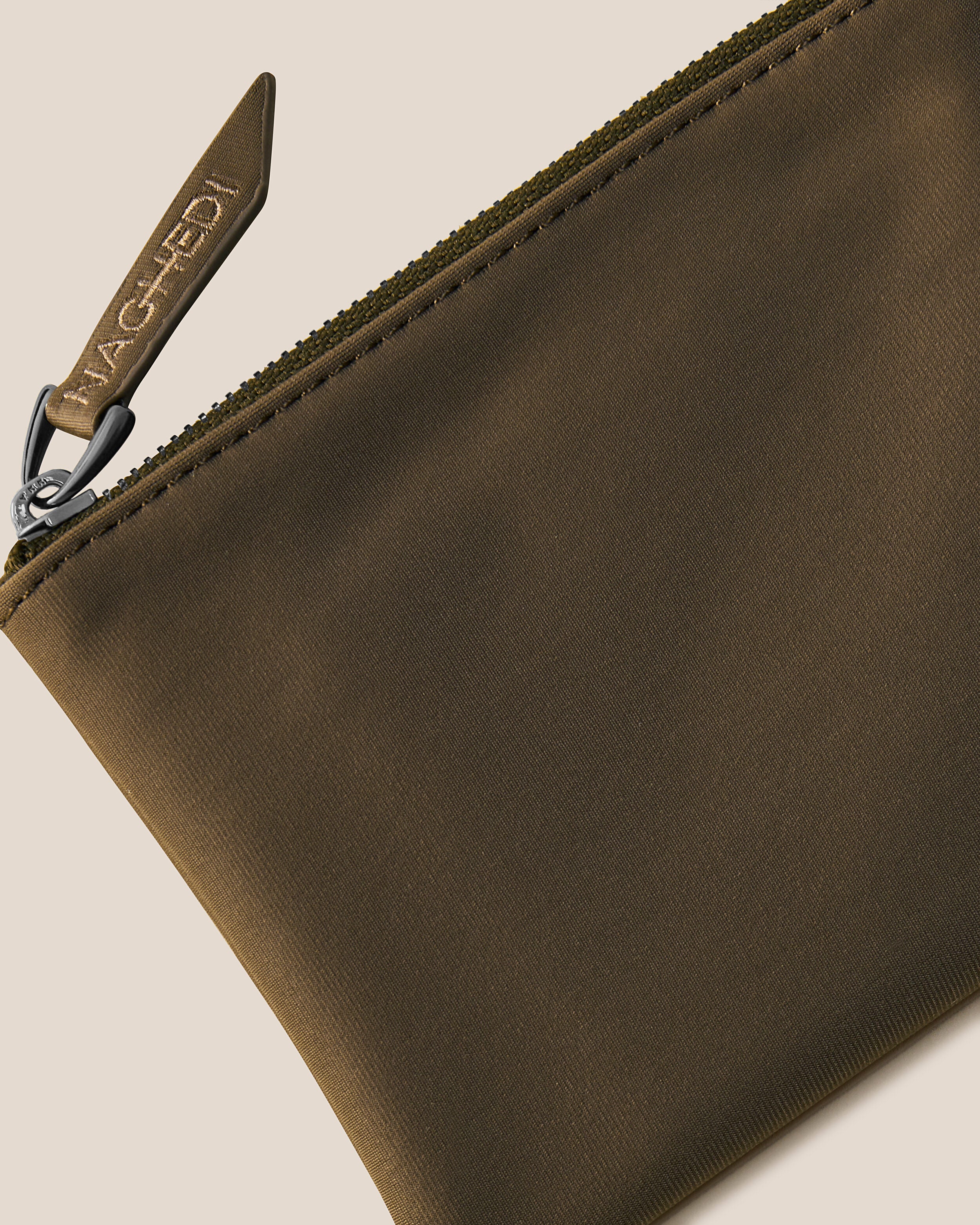 Close-up of included coordinating neoprene zippered pouch.
