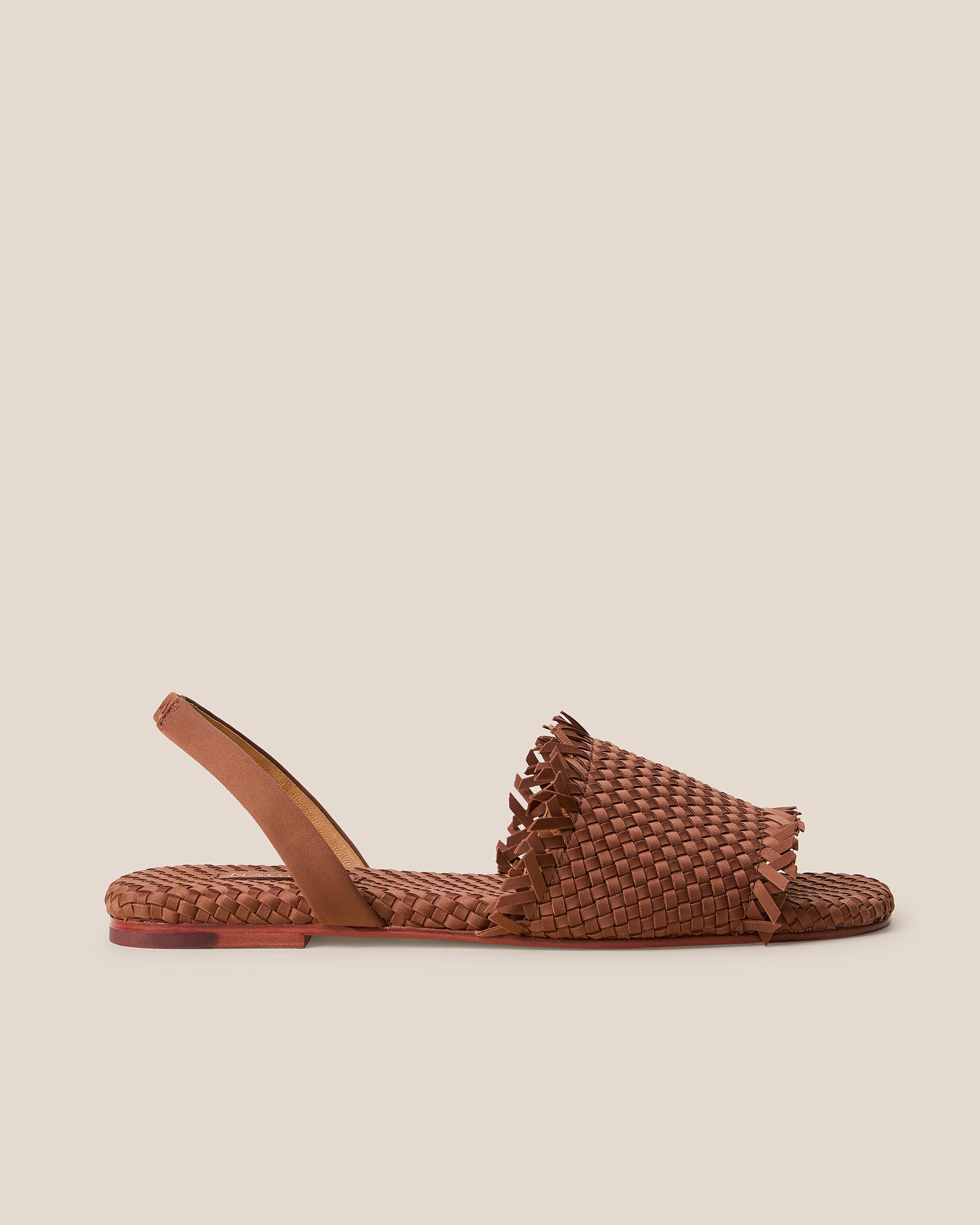 Side view of The Havana Sandal in Adobe, a clay brown tone, featuring an open toe and square silhouette, featuring a leather-lined neoprene slingback.