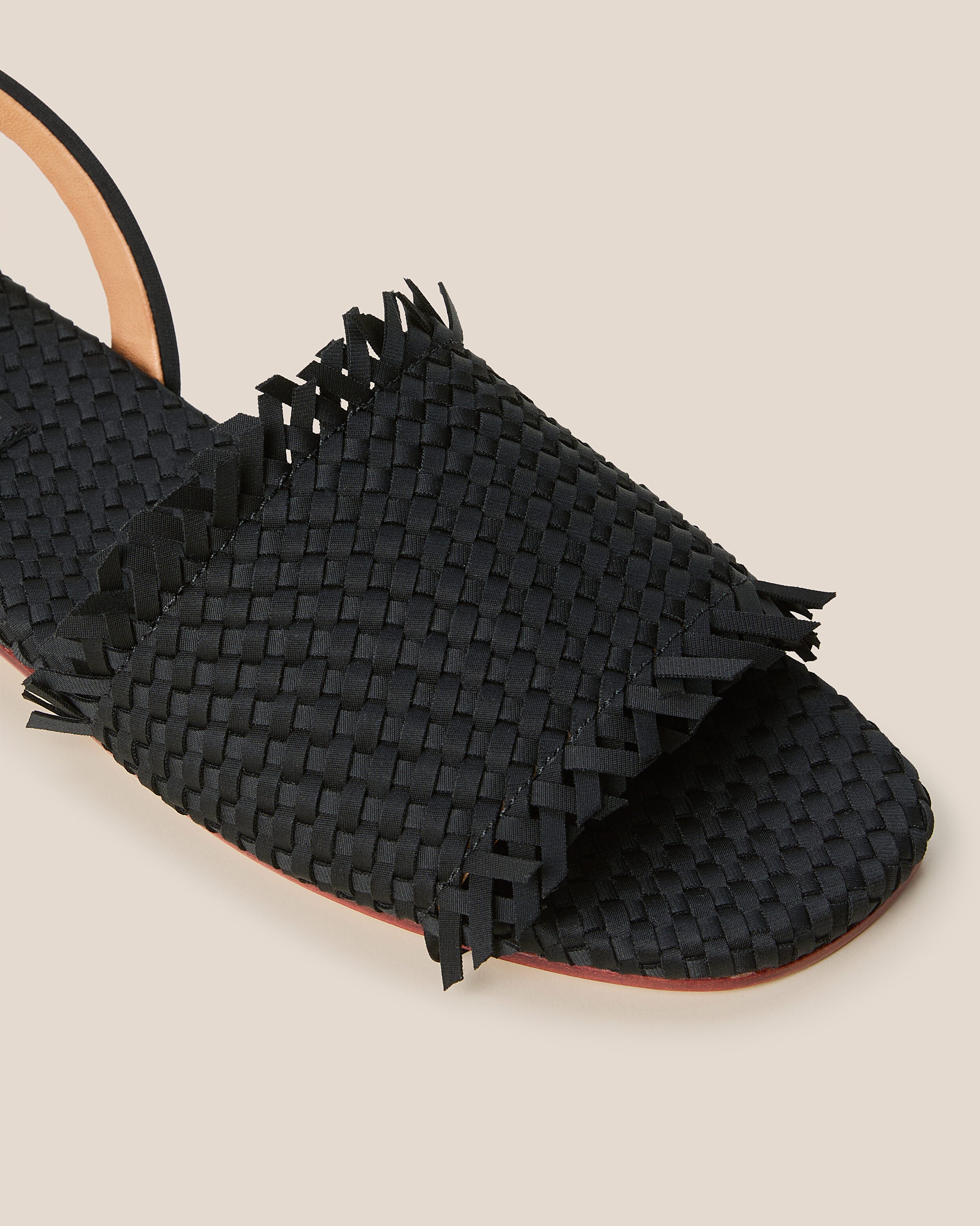 Close-up of The Havana Sandal in Onyx showing its open toe and square silhouette.