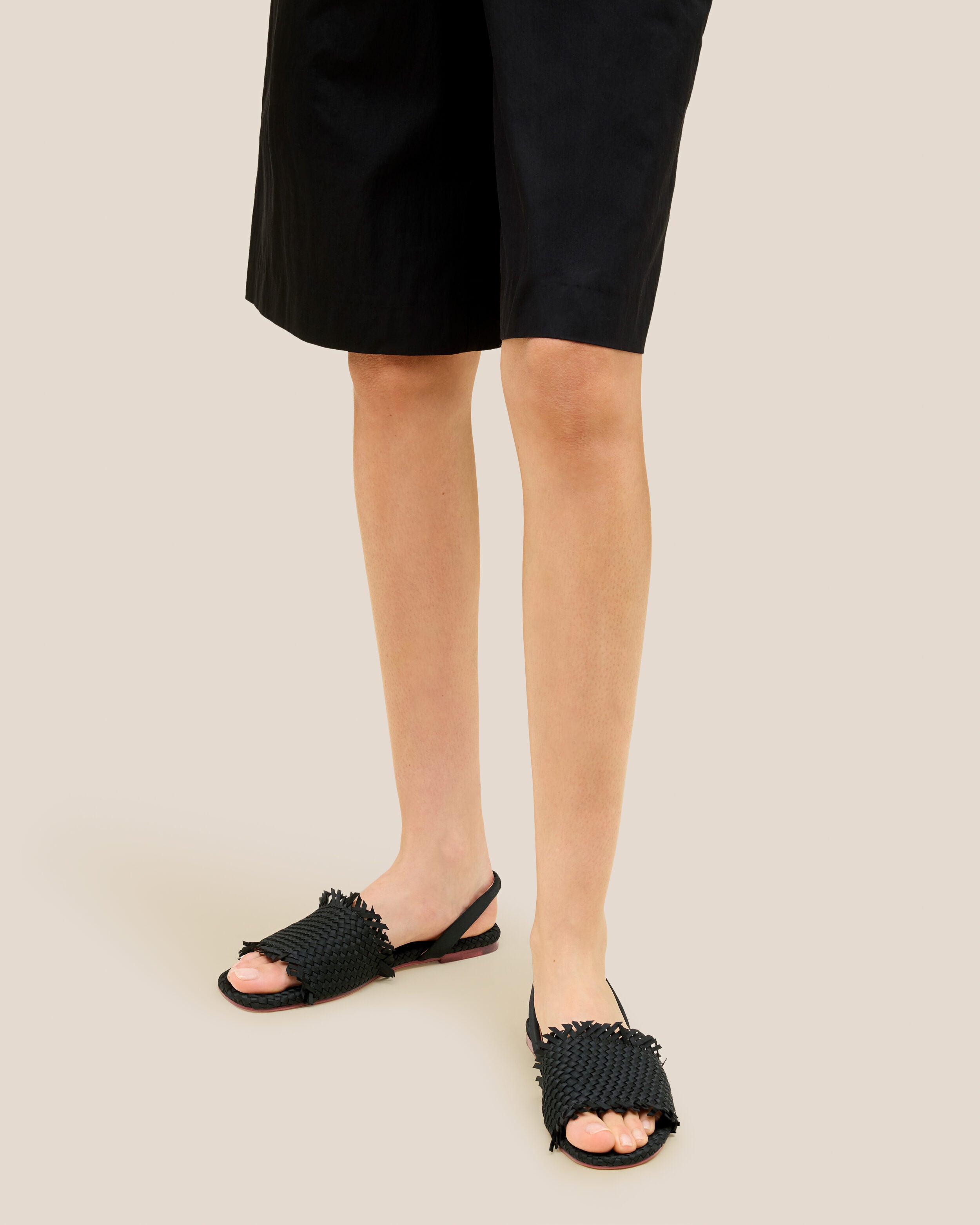 The Havana Sandal in Onyx shown on model.