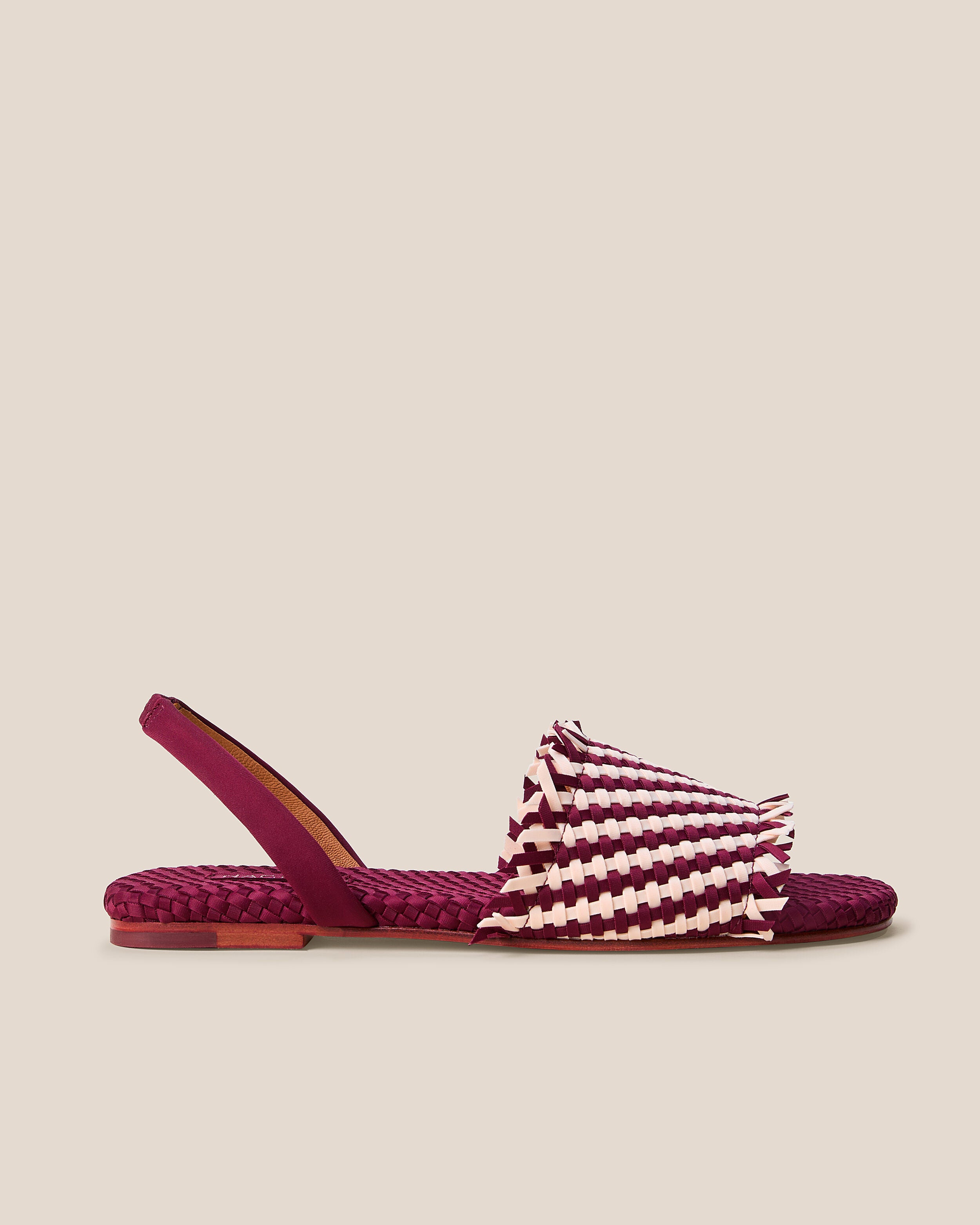 Side view of The Havana Sandal in Jaipur, a burgundy and peach tone, featuring an open toe and square silhouette, featuring a leather-lined neoprene slingback.