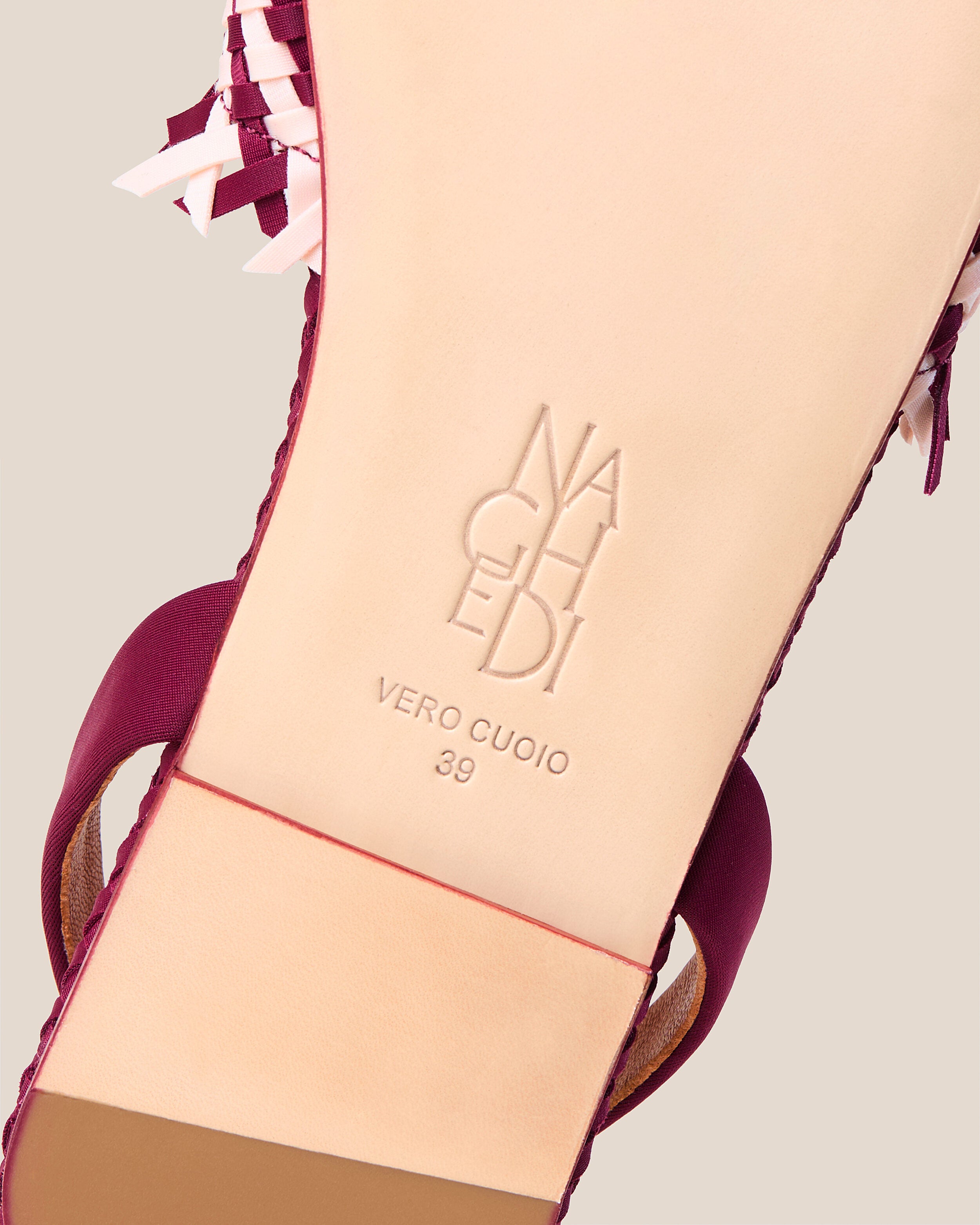 Shoe sole showing natural buffed leather sole, stamped NAGHEDI logo and size detail for The Havana Sandal in Jaipur.