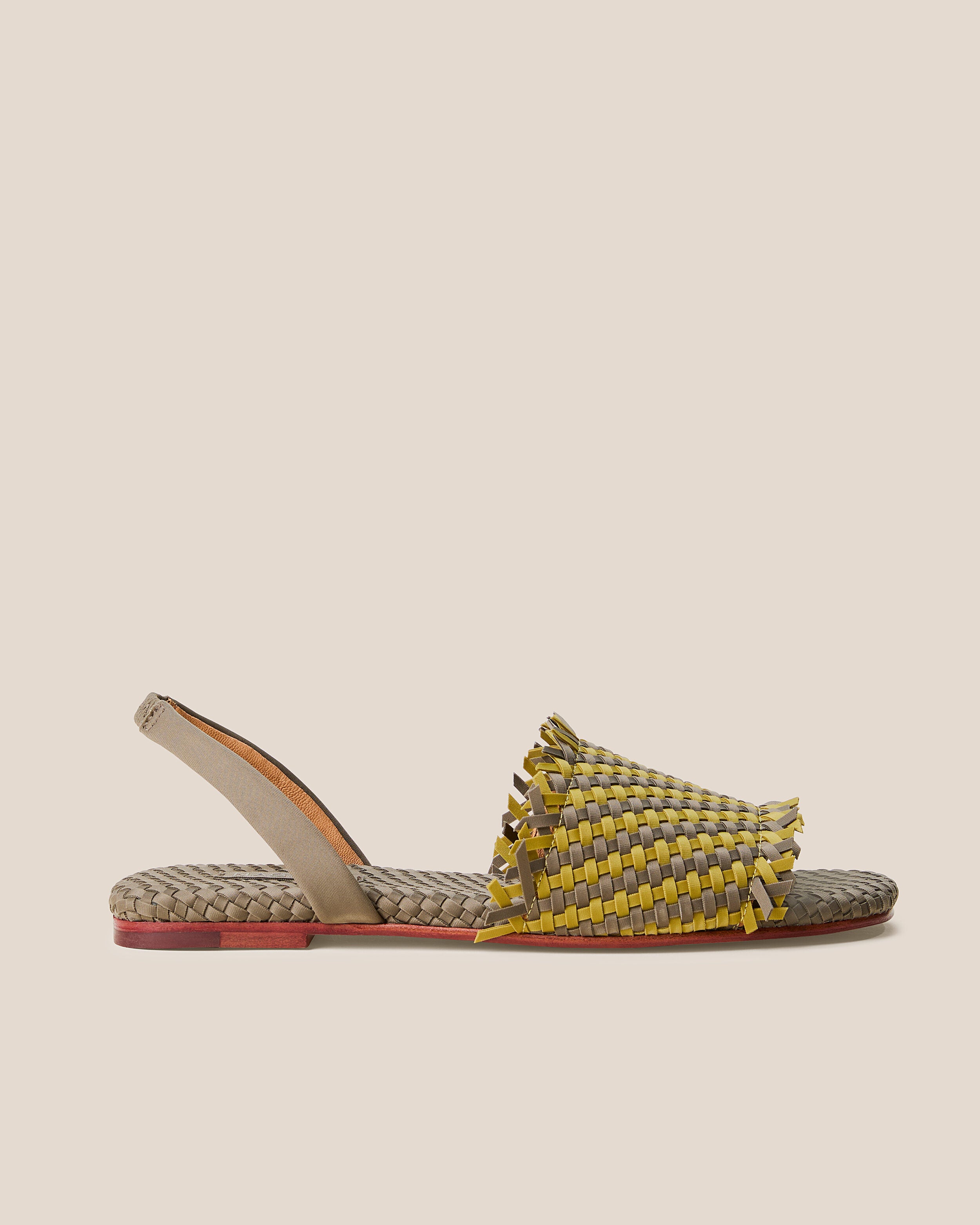 Side view of The Havana Sandal in Palma, a yellow-green and muted earh brown tone, featuring an open toe and square silhouette, featuring a leather-lined neoprene slingback.