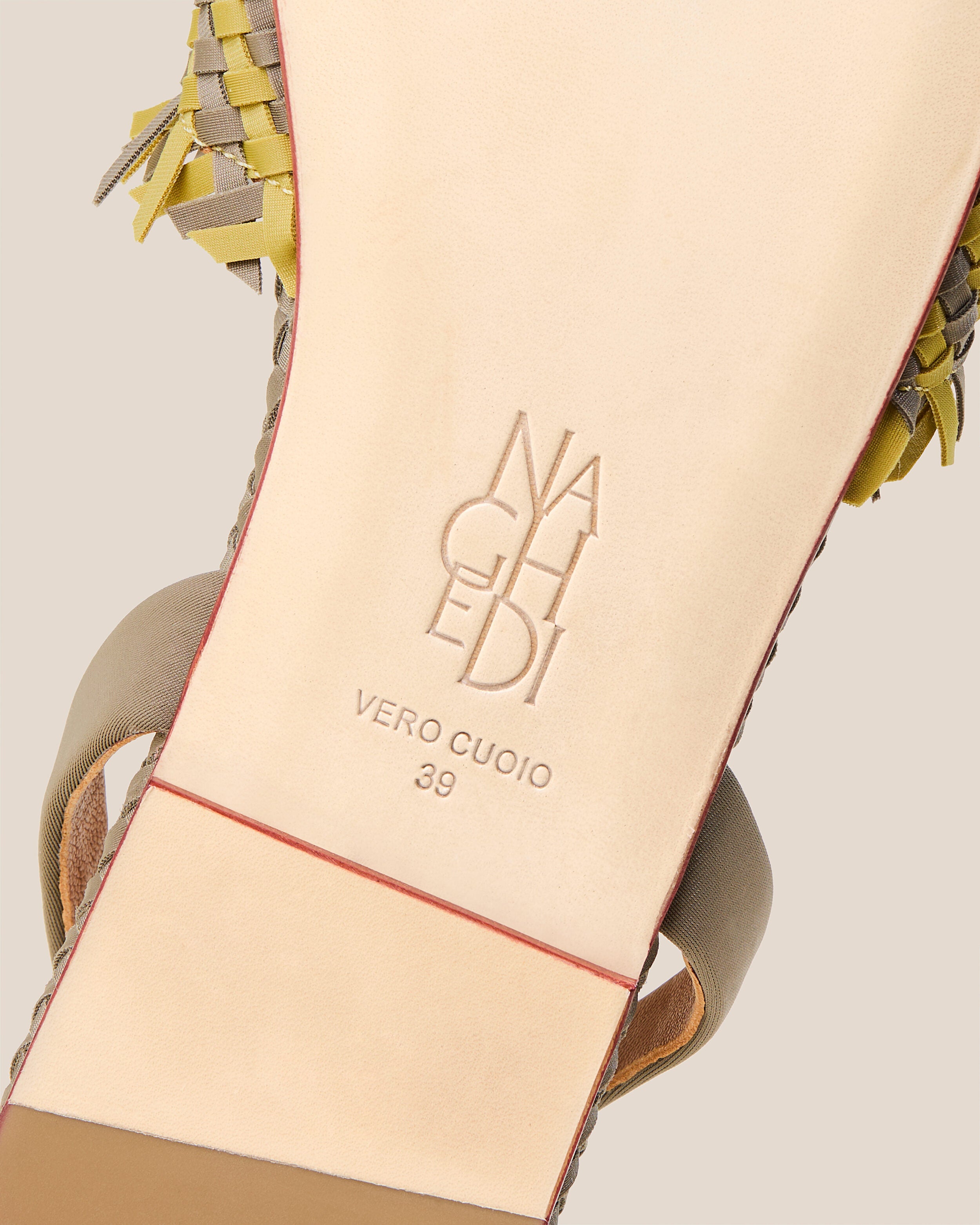 Shoe sole showing natural buffed leather sole, stamped NAGHEDI logo and size detail for The Havana Sandal in Palma.