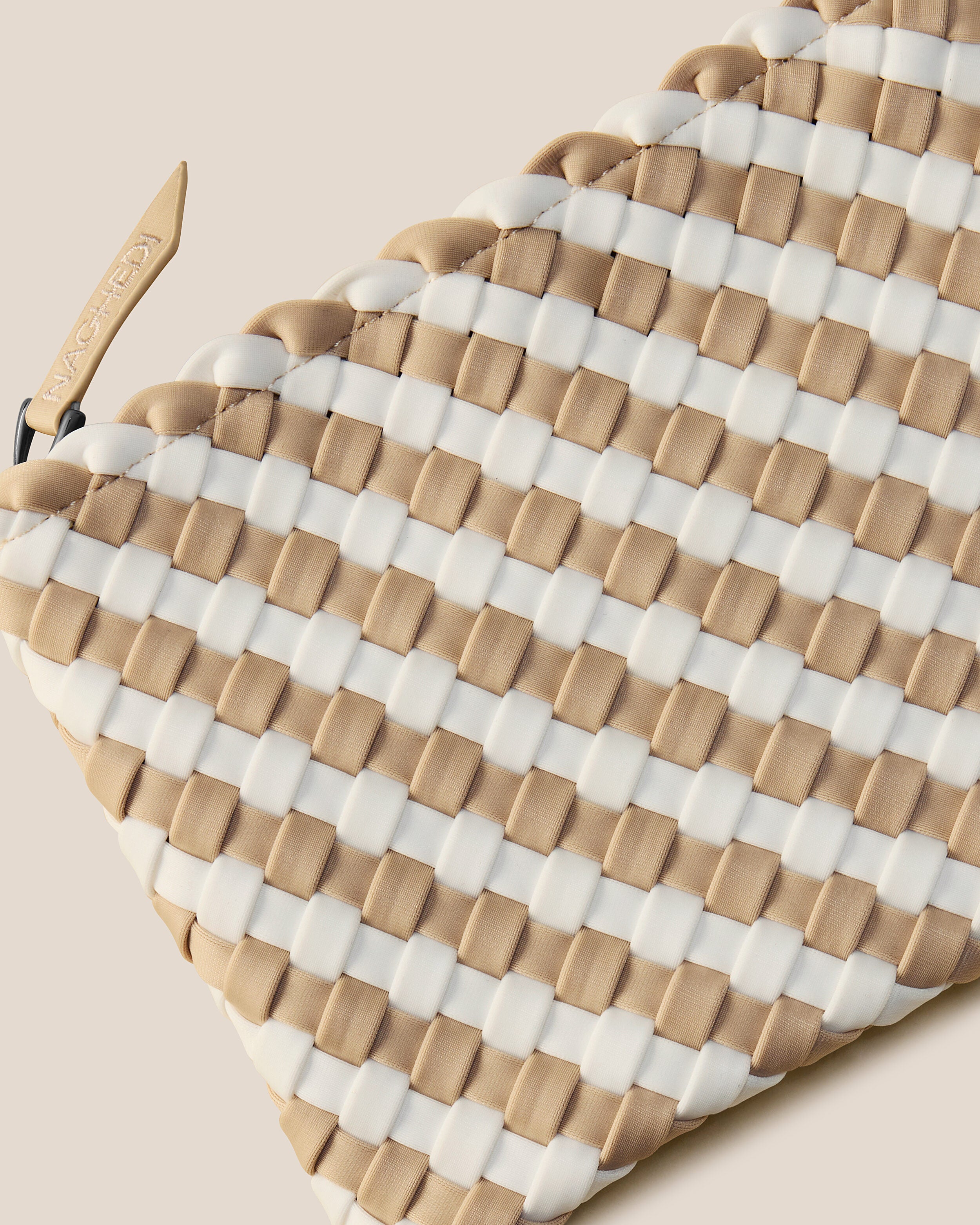 Close-up of included matching woven zippered pouch.