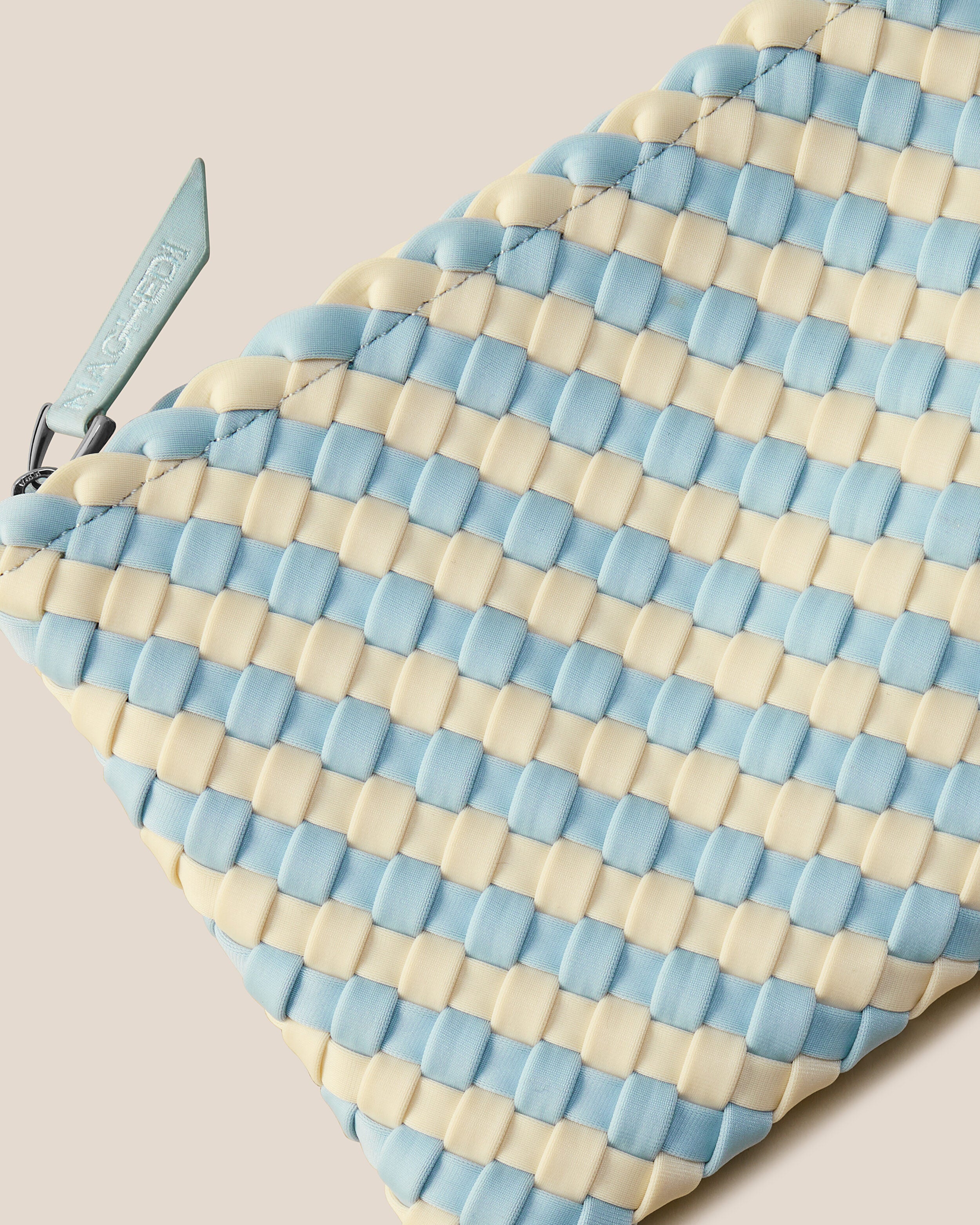 Close-up of included matching woven zippered pouch.