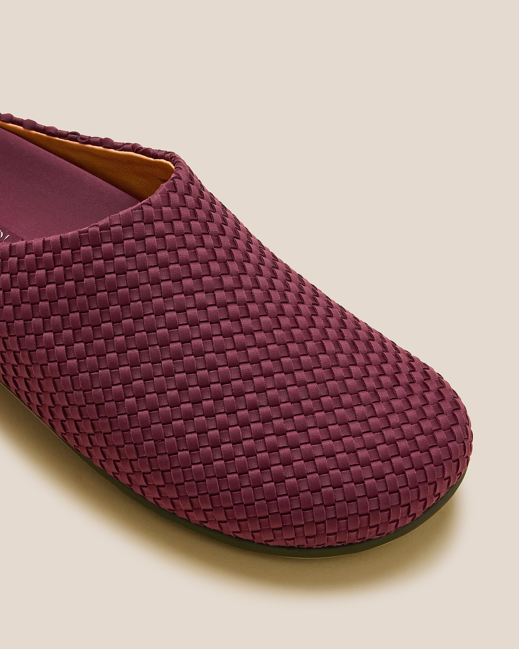 Close-up of Hudson Clogs in Bordeaux showing its closed toe and round silhouette.