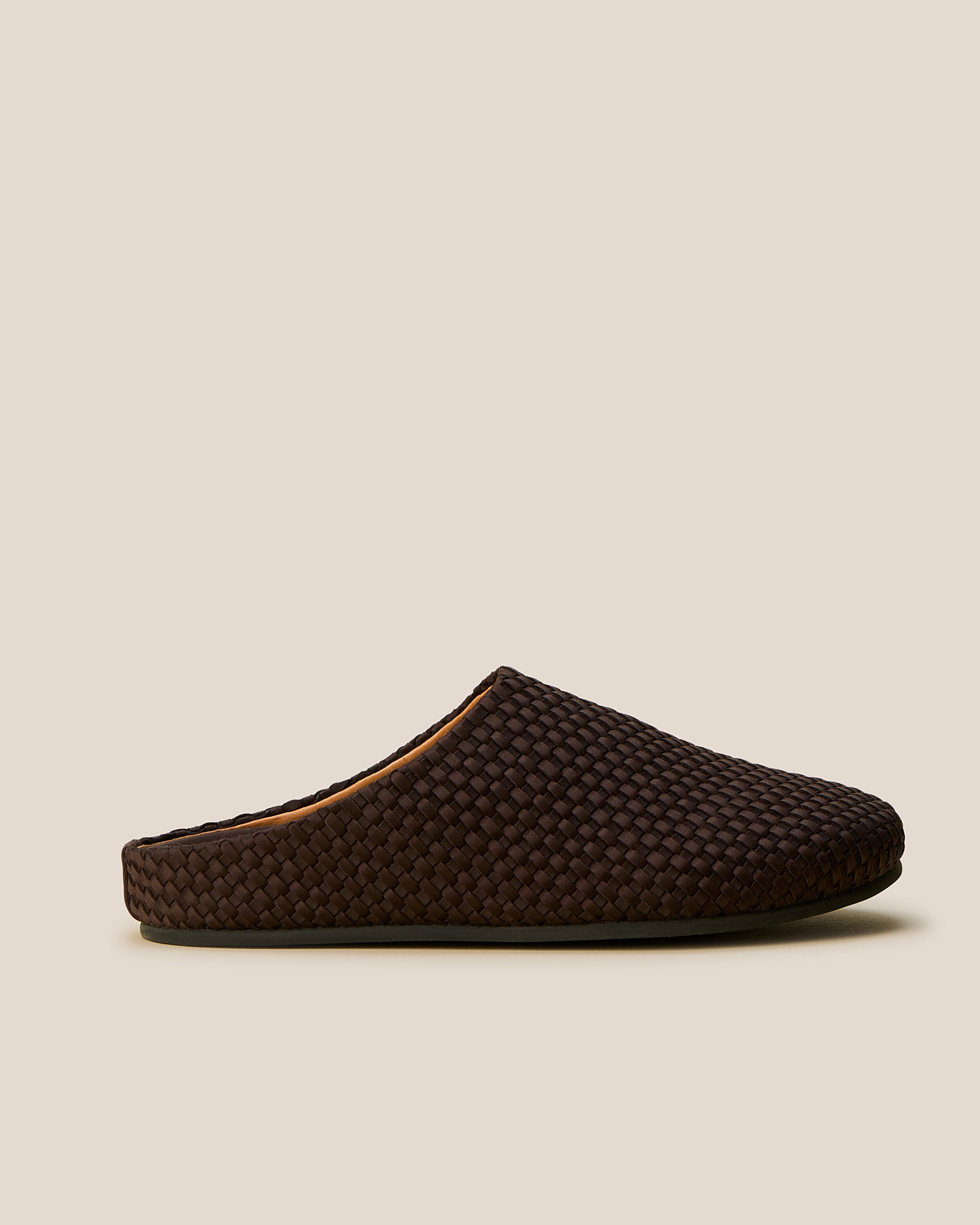 Side view of The Hudson Clog in Chocolate, a dark chocolate brown tone, featuring a closed toe and round silhouette.