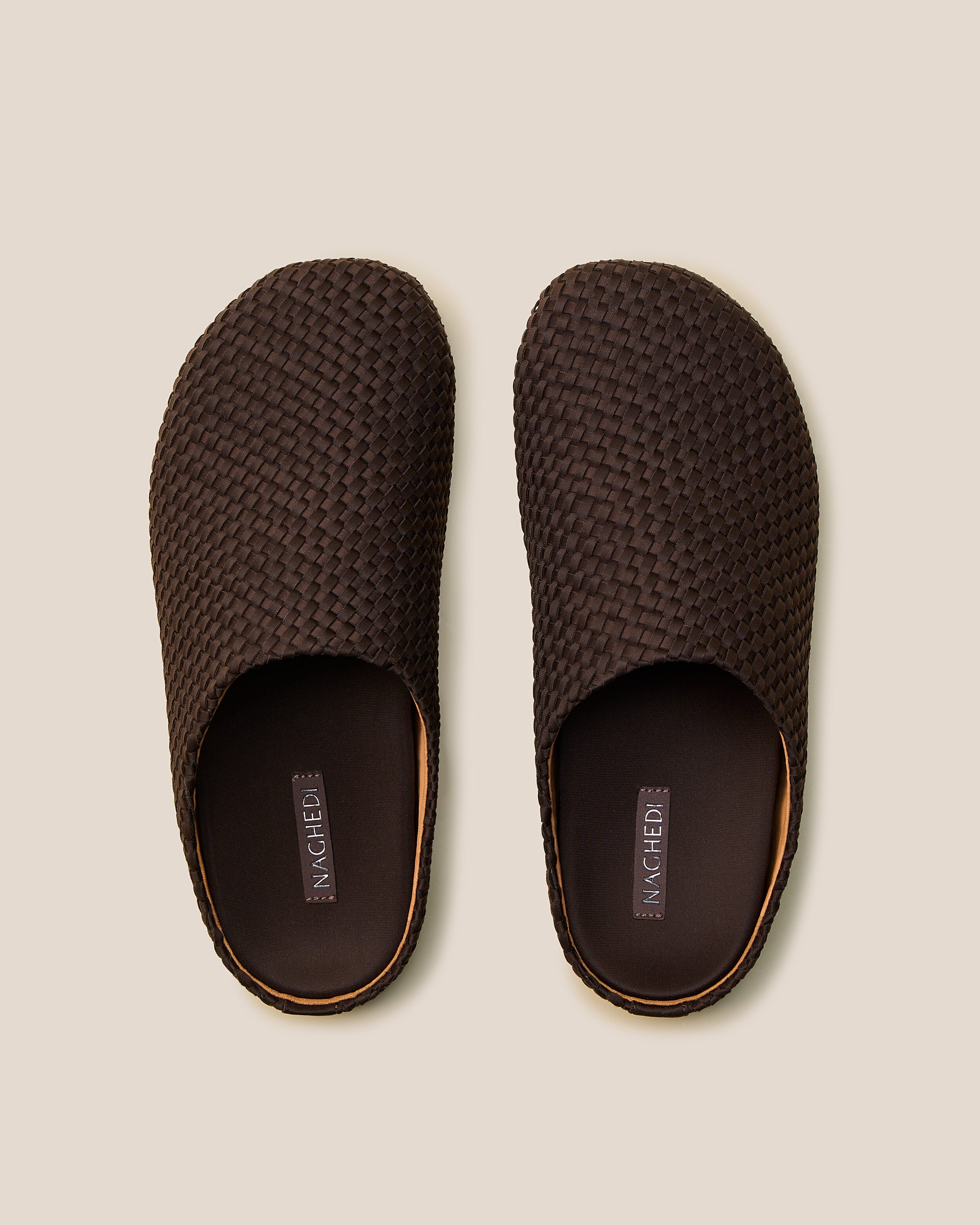Top view of pair of The Hudson Clog in Chocolate showing the padded, molded neoprene footbed.