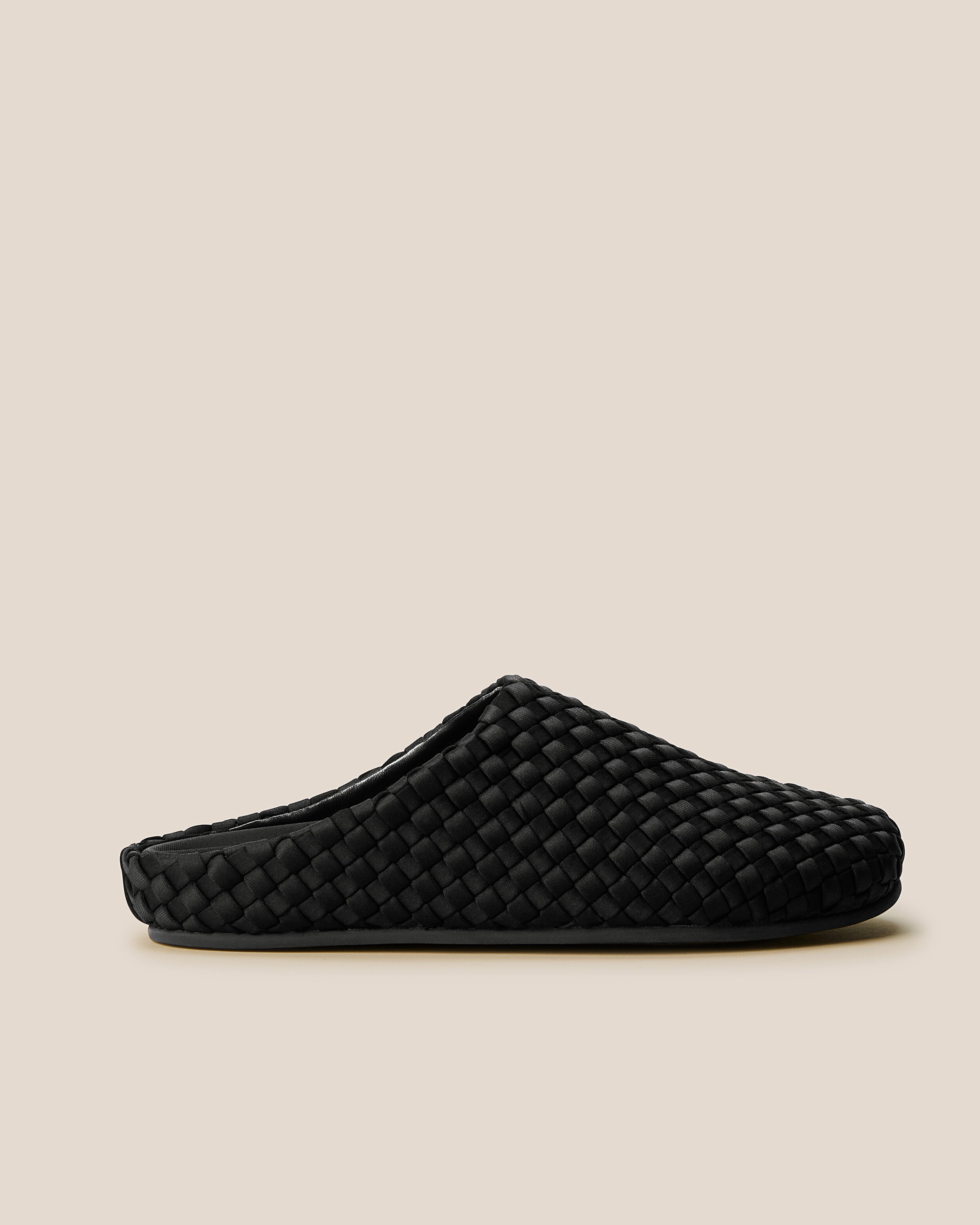Side view of The Hudson Clog in Onyx, a true black tone, featuring a closed toe and round silhouette.