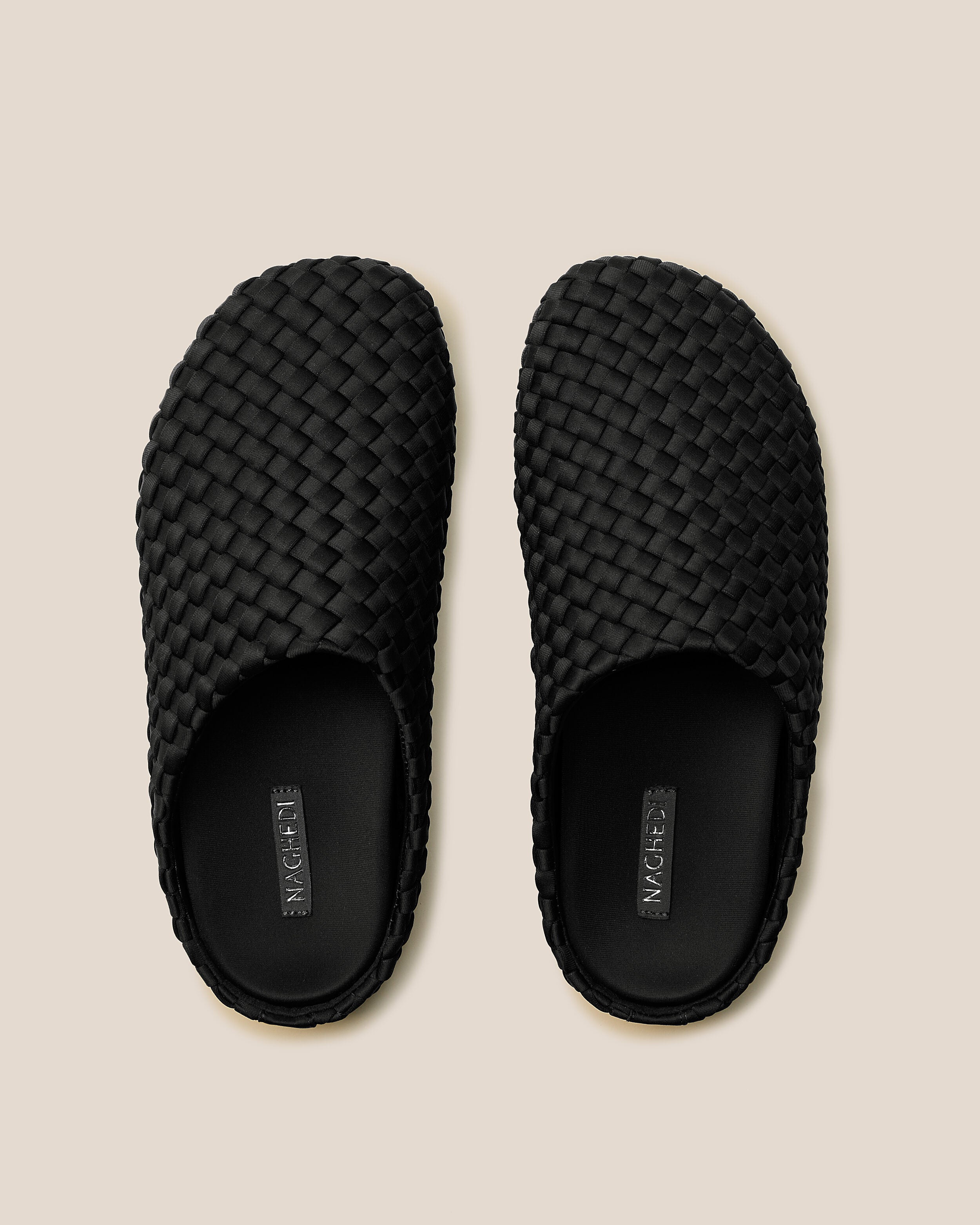 Top view of pair of The Hudson Clog in Onyx showing the padded, molded neoprene footbed.