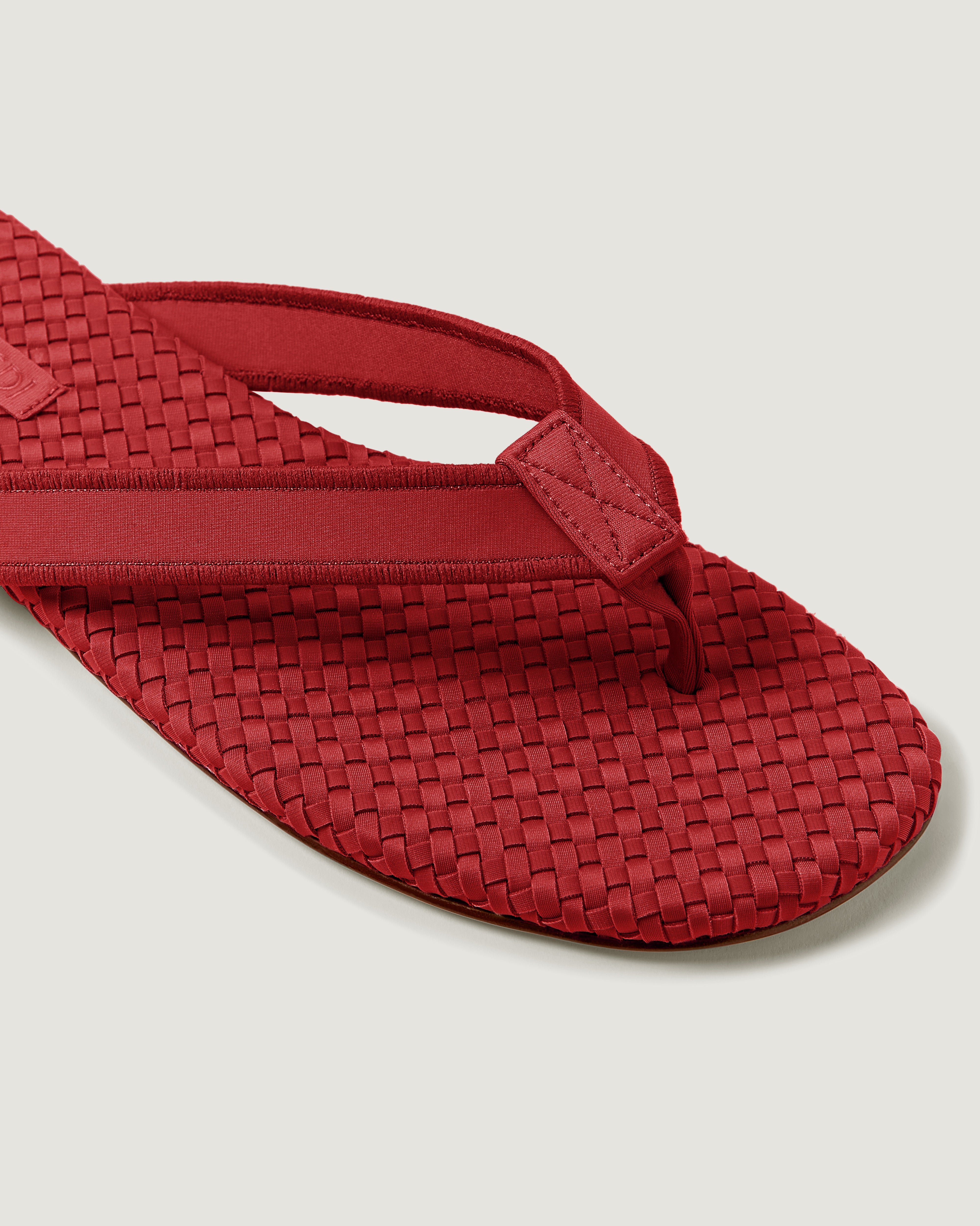 Close-up of The Hydra Flip Flop in Rosso showing its open toe and square silhouette.