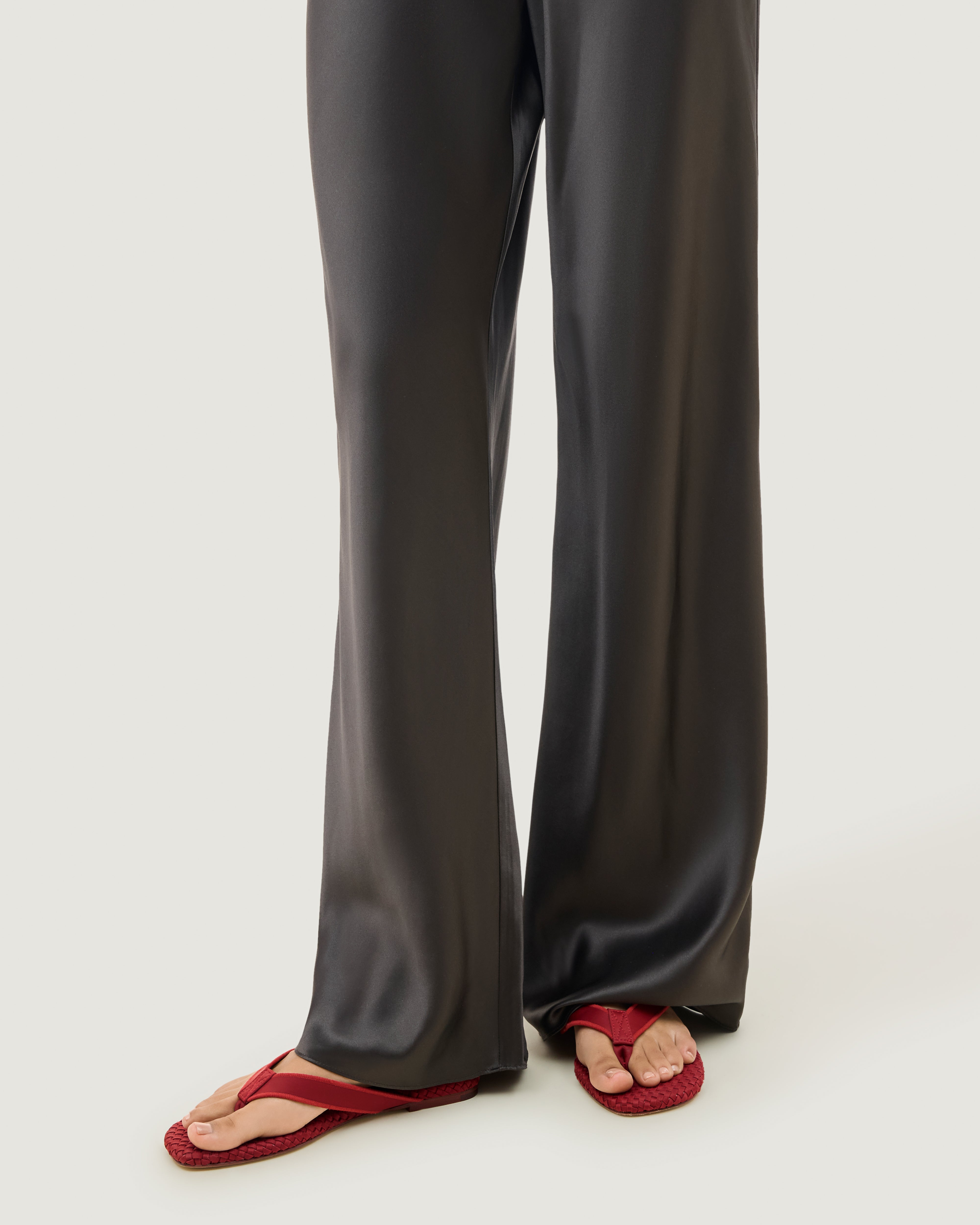 The Hydra Flip Flop in Rosso shown on model.