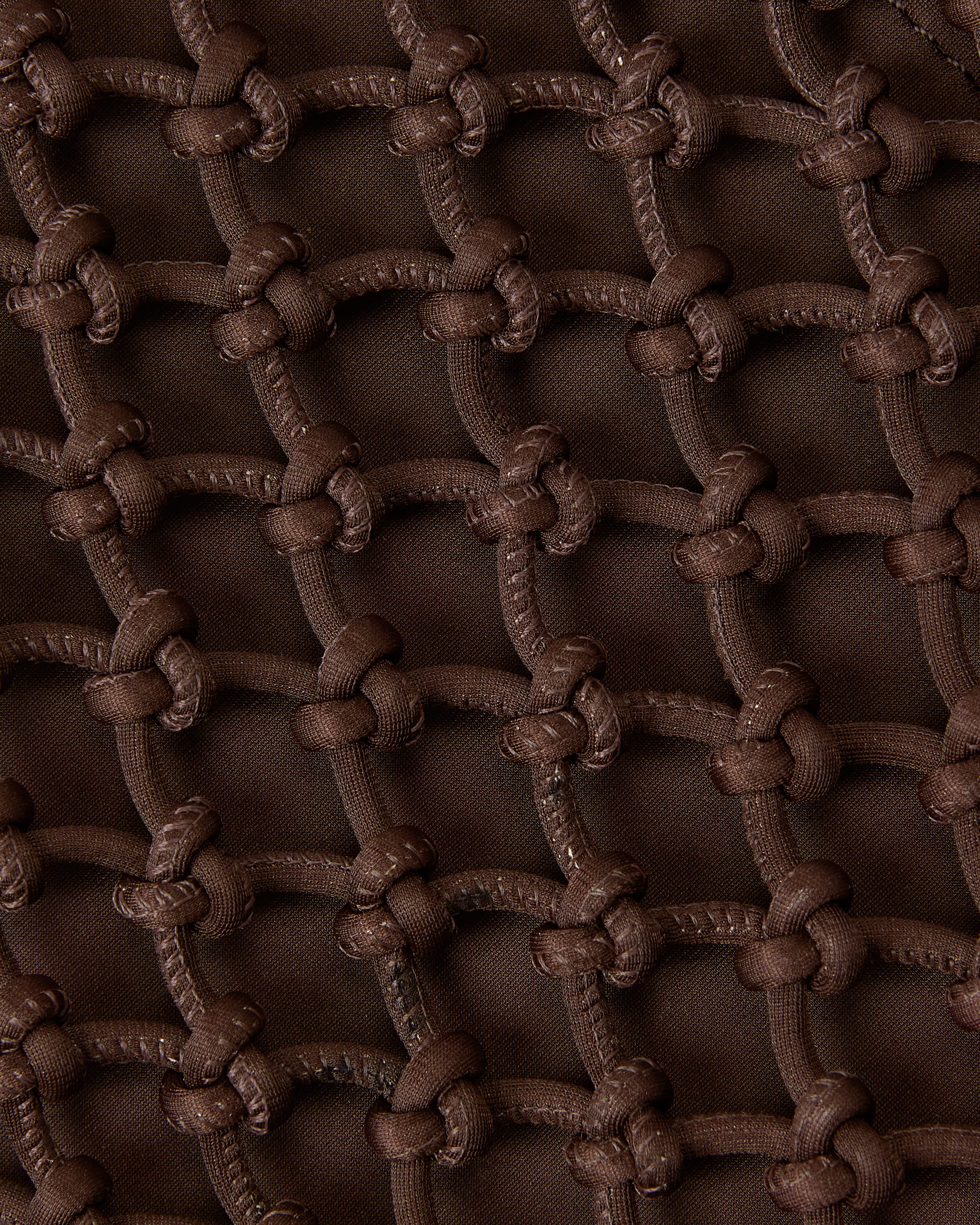 Close view of structure of woven neoprene net bag in chocolate brown
