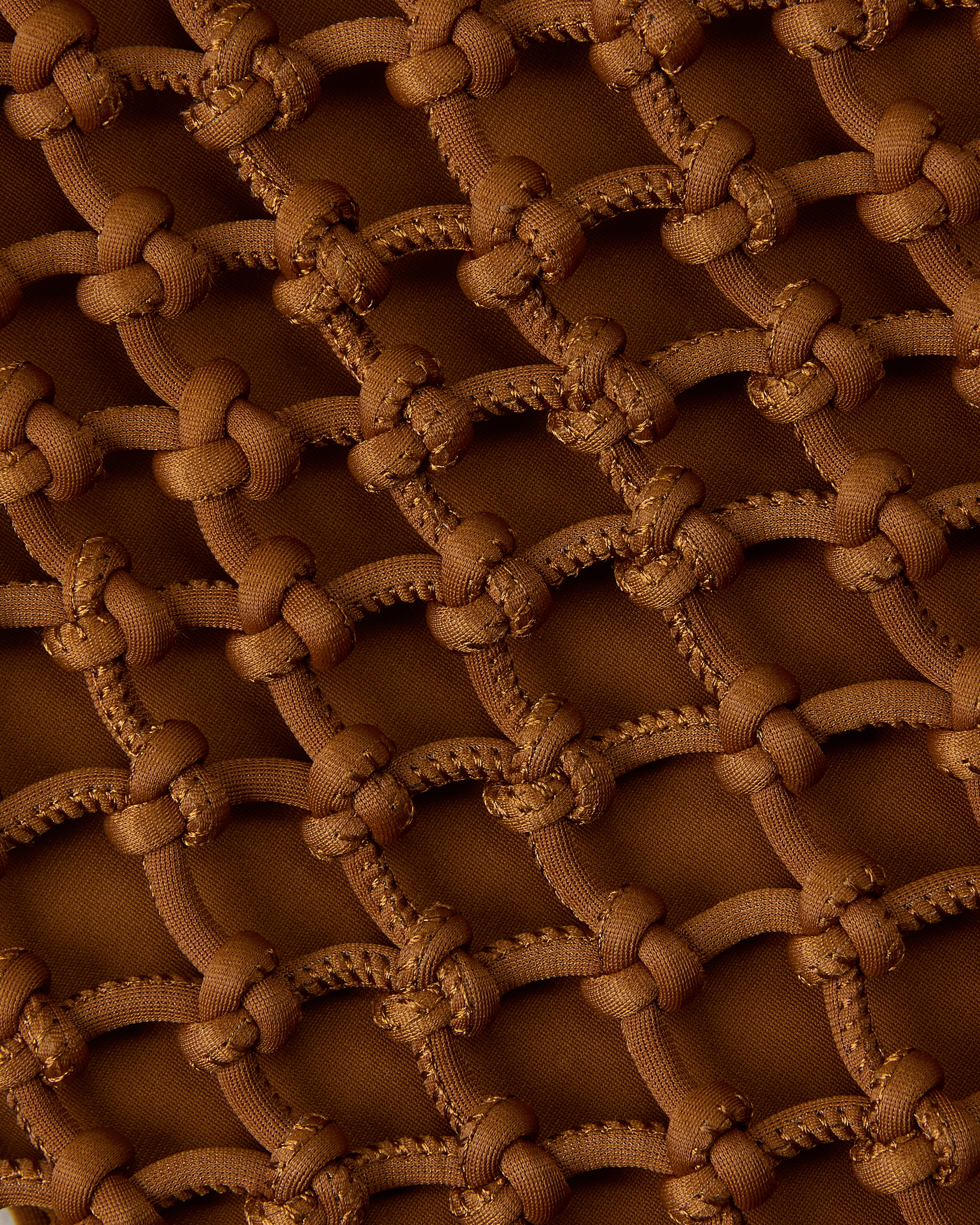 Close up of net weave pattern in saddle brown