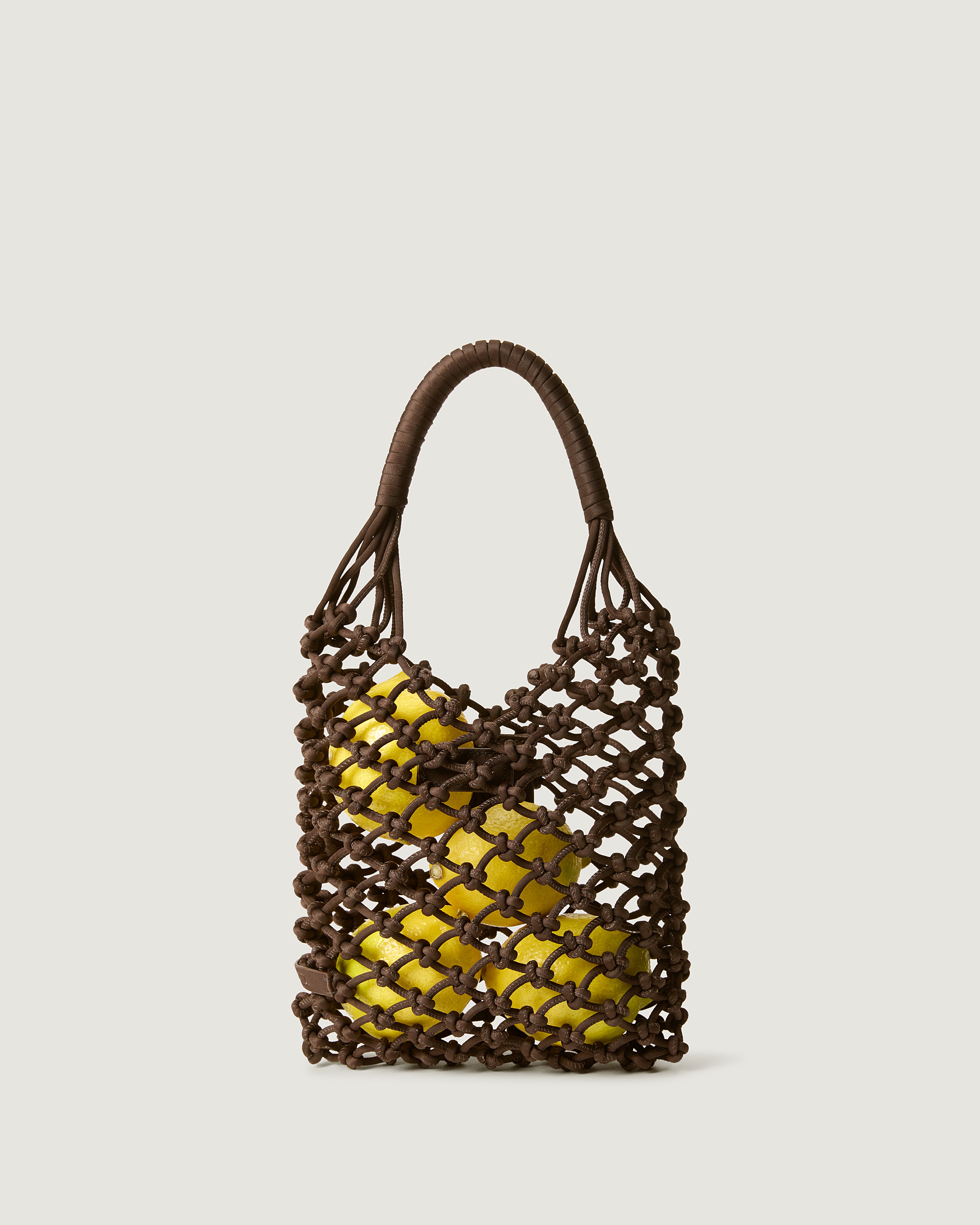 Small woven neoprene net bag in chocolate brown with fruit inside