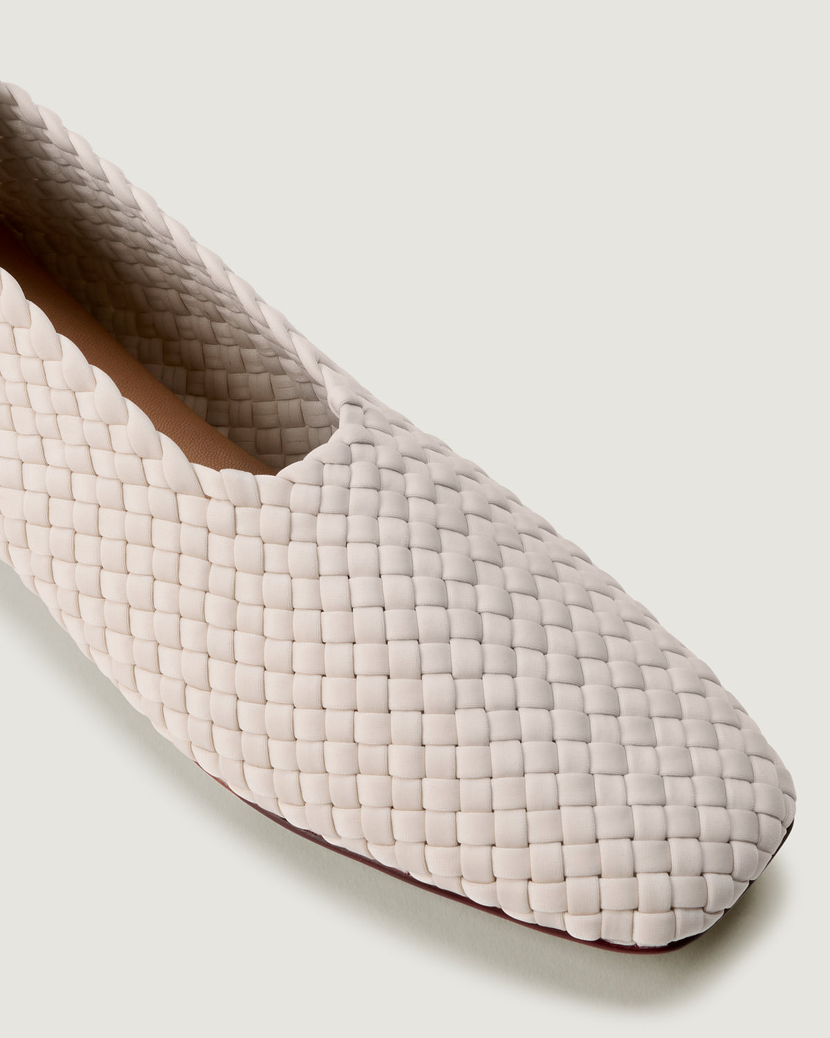 Close-up of The Jeju Glove flat in Linen showing its closed toe and square silhouette.