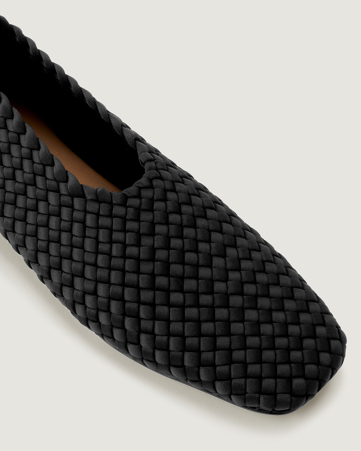 Close-up of The Jeju Glove flat in Onyx showing its closed toe and square silhouette.