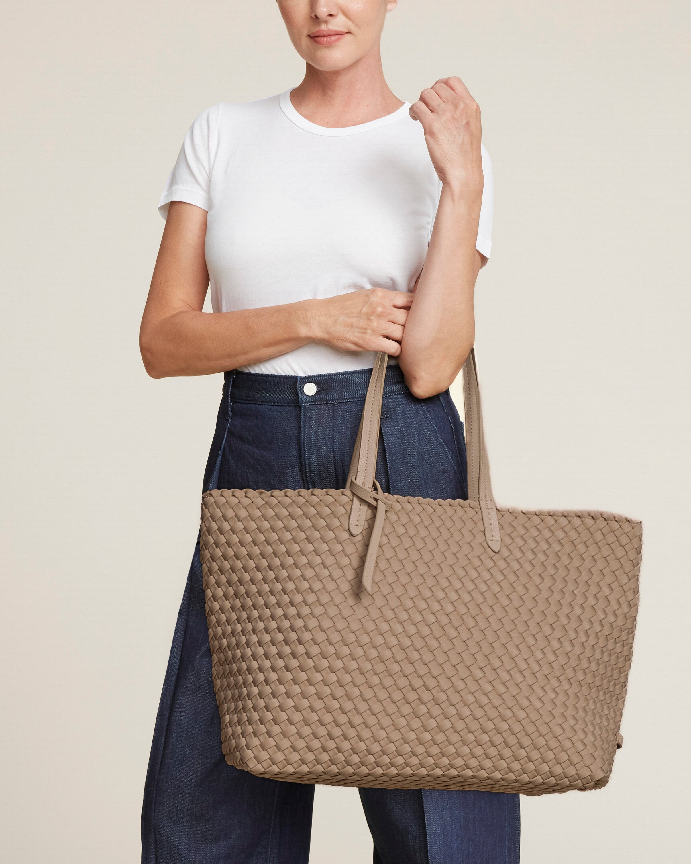 Jetsetter Tote in Cashmere shown on model to illustrate scale and soft silhouette.