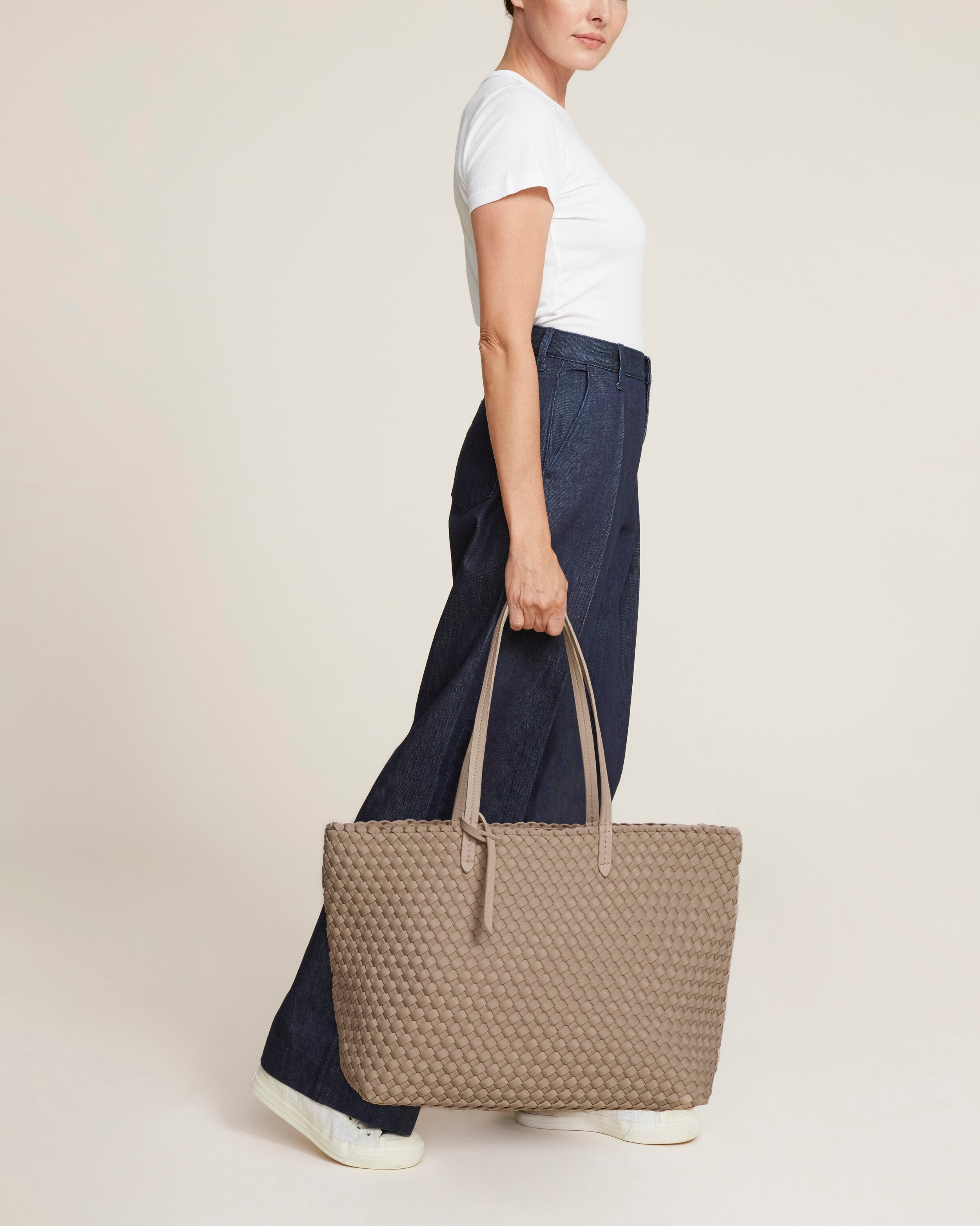 Jetsetter Tote in Cashmere shown on model to illustrate scale and soft silhouette.