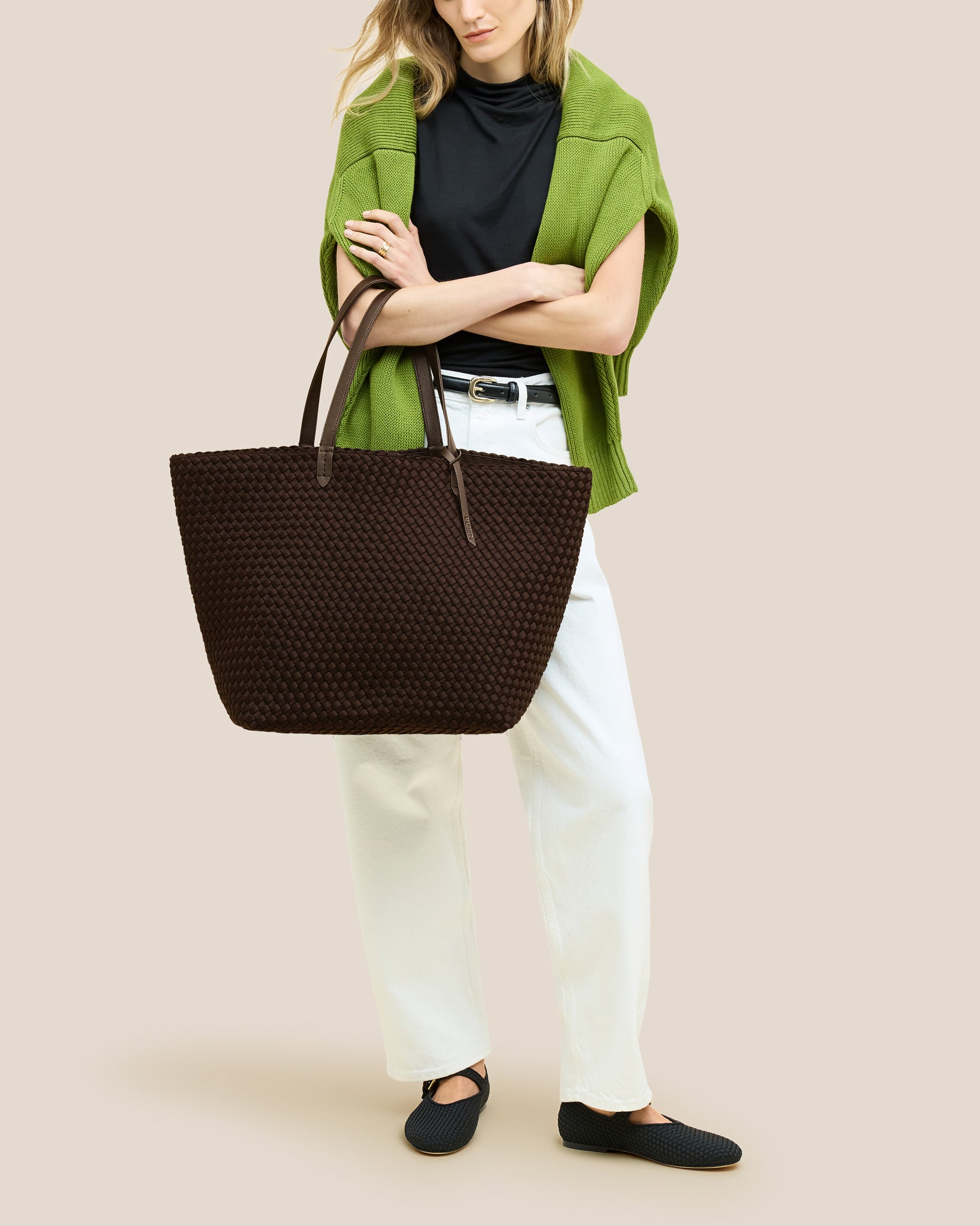 Jetsetter Large Tote Bag in Chocolate shown on model to illustrate scale and soft silhouette.